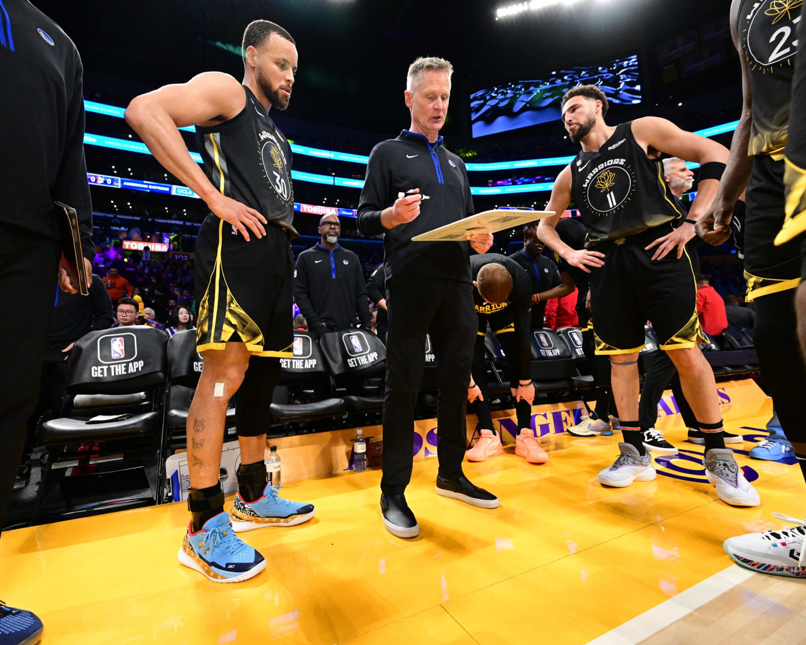 LOS ANGELES, CA - MARCH 5: Head Coach Steve Kerr of the Golden State Warriors and Klay Thompson #11 and Damian Jones #30 of the Los Angeles Lakers looks on during a time-out on March 5, 2023 at Crypto.Com Arena in Los Angeles, California. NOTE TO USER: User expressly acknowledges and agrees that, by downloading and/or using this Photograph, user is consenting to the terms and conditions of the Getty Images License Agreement. Mandatory Copyright Notice: Copyright 2023 NBAE (Photo by Adam Pantozzi/NBAE via Getty Images) LOS ANGELES, CA - MARCH 5: Head Coach Steve Kerr of the Golden State Warriors and Klay Thompson #11 and Damian Jones #30 of the Los Angeles Lakers looks on during a time-out on March 5, 2023 at Crypto.Com Arena in Los Angeles, California. NOTE TO USER: User expressly acknowledges and agrees that, by downloading and/or using this Photograph, user is consenting to the terms and conditions of the Getty Images License Agreement. Mandatory Copyright Notice: Copyright 2023 NBAE (Photo by Adam Pantozzi/NBAE via Getty Images)