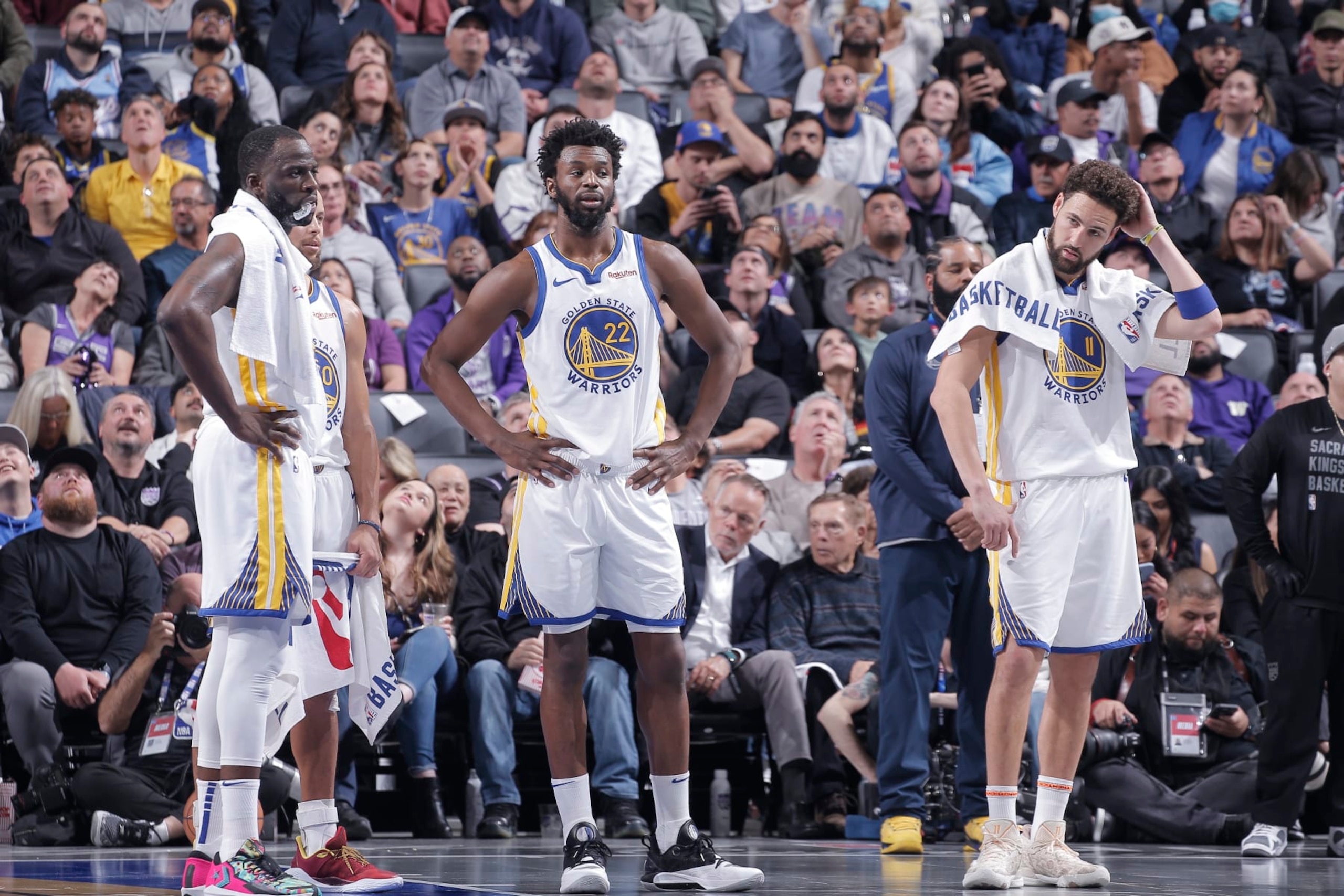 SACRAMENTO, CA - NOVEMBER 28: Draymond Green #23, Stephen Curry #30, Andrew Wiggins #22, and Klay Thompson #11 of the Golden State Warriors look on during the game against the Sacramento Kings during the In-Season Tournament on November 28, 2023 at Golden 1 Center in Sacramento, California. NOTE TO USER: User expressly acknowledges and agrees that, by downloading and or using this photograph, User is consenting to the terms and conditions of the Getty Images Agreement. Mandatory Copyright Notice: Copyright 2023 NBAE (Photo by Rocky Widner/NBAE via Getty Images) SACRAMENTO, CA - NOVEMBER 28: Draymond Green #23, Stephen Curry #30, Andrew Wiggins #22, and Klay Thompson #11 of the Golden State Warriors look on during the game against the Sacramento Kings during the In-Season Tournament on November 28, 2023 at Golden 1 Center in Sacramento, California. NOTE TO USER: User expressly acknowledges and agrees that, by downloading and or using this photograph, User is consenting to the terms and conditions of the Getty Images Agreement. Mandatory Copyright Notice: Copyright 2023 NBAE (Photo by Rocky Widner/NBAE via Getty Images)