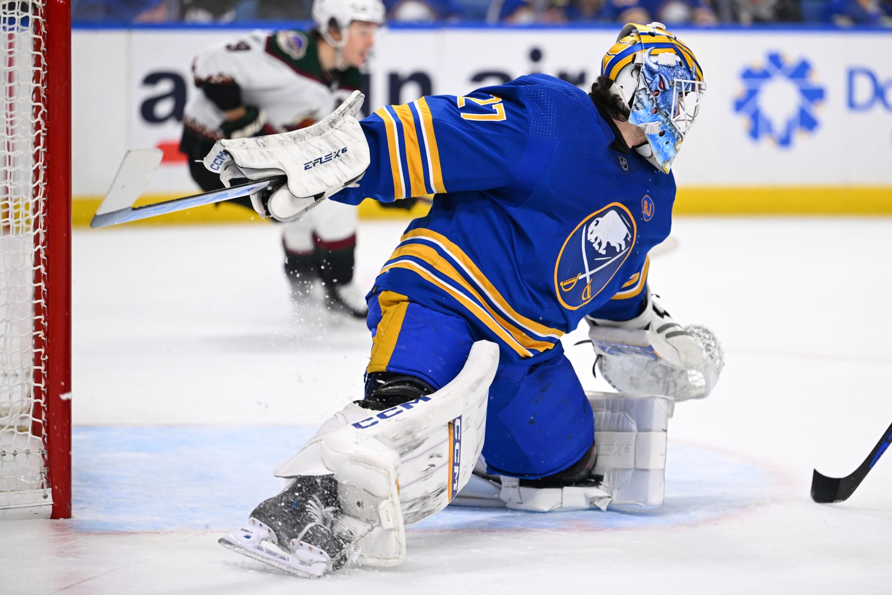BUFFALO, NEW YORK - DECEMBER 11: Devon Levi #27 of the Buffalo Sabres makes a save during an NHL game against the Arizona Coyotes on December 11, 2023 at KeyBank Center in Buffalo, New York. (Photo by Joe Hrycych/NHLI via Getty Images)