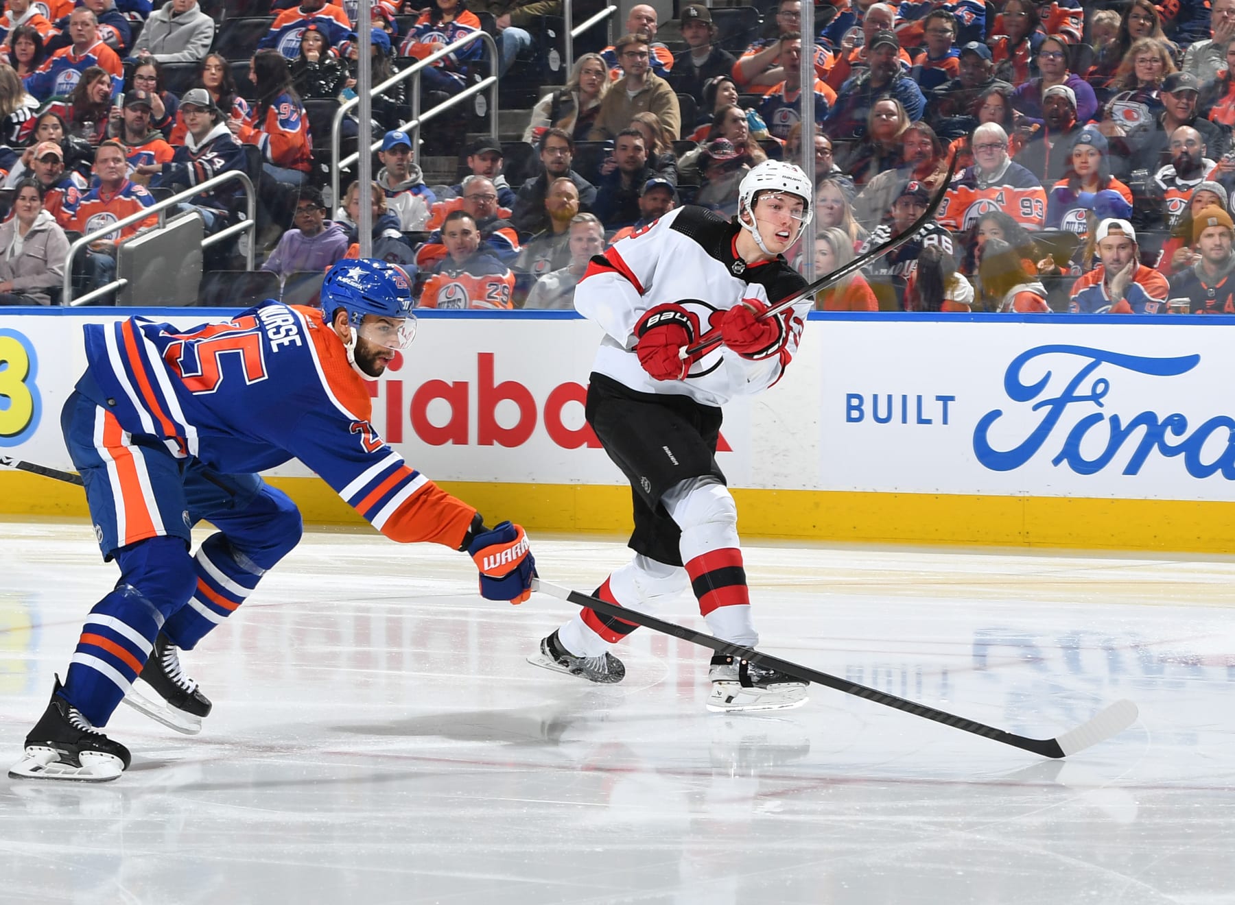 EDMONTON, CANADA - DECEMBER 10: Nico Hischier #13 of the New Jersey Devils takes a shot during the game against the Edmonton Oilers at Rogers Place on December 10, 2023, in Edmonton, Alberta, Canada. (Photo by Andy Devlin/NHLI via Getty Images)