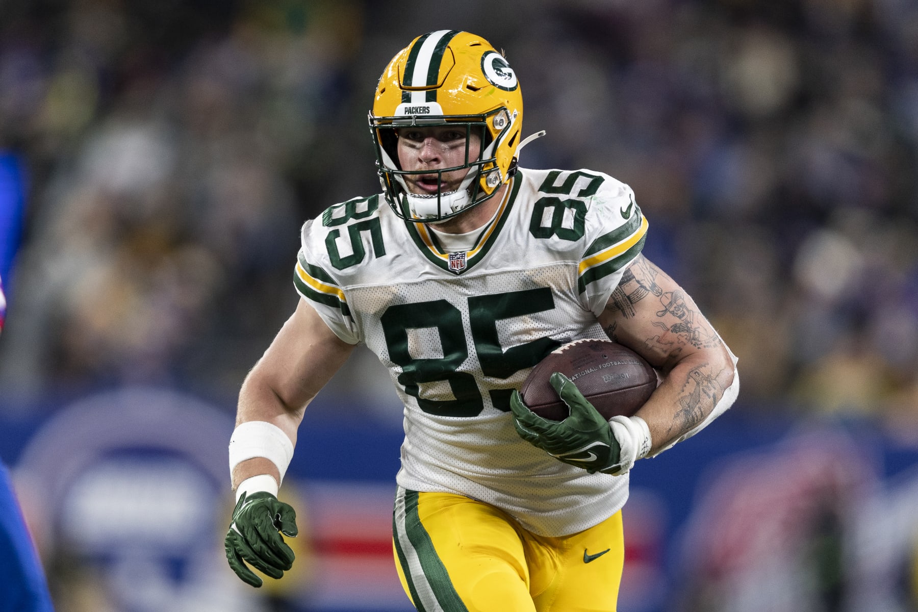 EAST RUTHERFORD, NEW JERSEY - DECEMBER 11: Tucker Kraft #85 of the Green Bay Packers runs with the ball during an NFL football game between the New York Giants and the Green Bay Packers at MetLife Stadium on December 11, 2023 in East Rutherford, New Jersey. (Photo by Michael Owens/Getty Images)