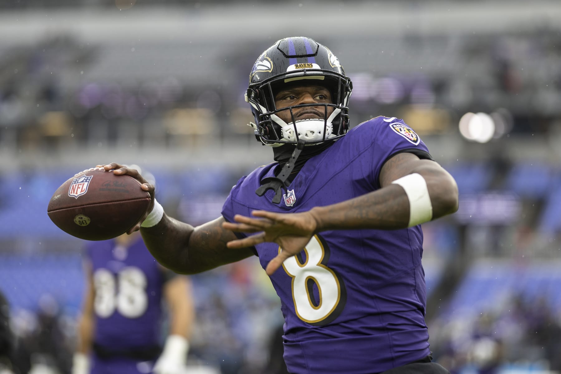 BALTIMORE, MARYLAND - DECEMBER 10: Lamar Jackson #8 of the Baltimore Ravens throws a pass as he warms up prior to an NFL football game between the Baltimore Ravens and the Los Angeles Rams at M&T Bank Stadium on December 10, 2023 in Baltimore, Maryland. (Photo by Michael Owens/Getty Images)