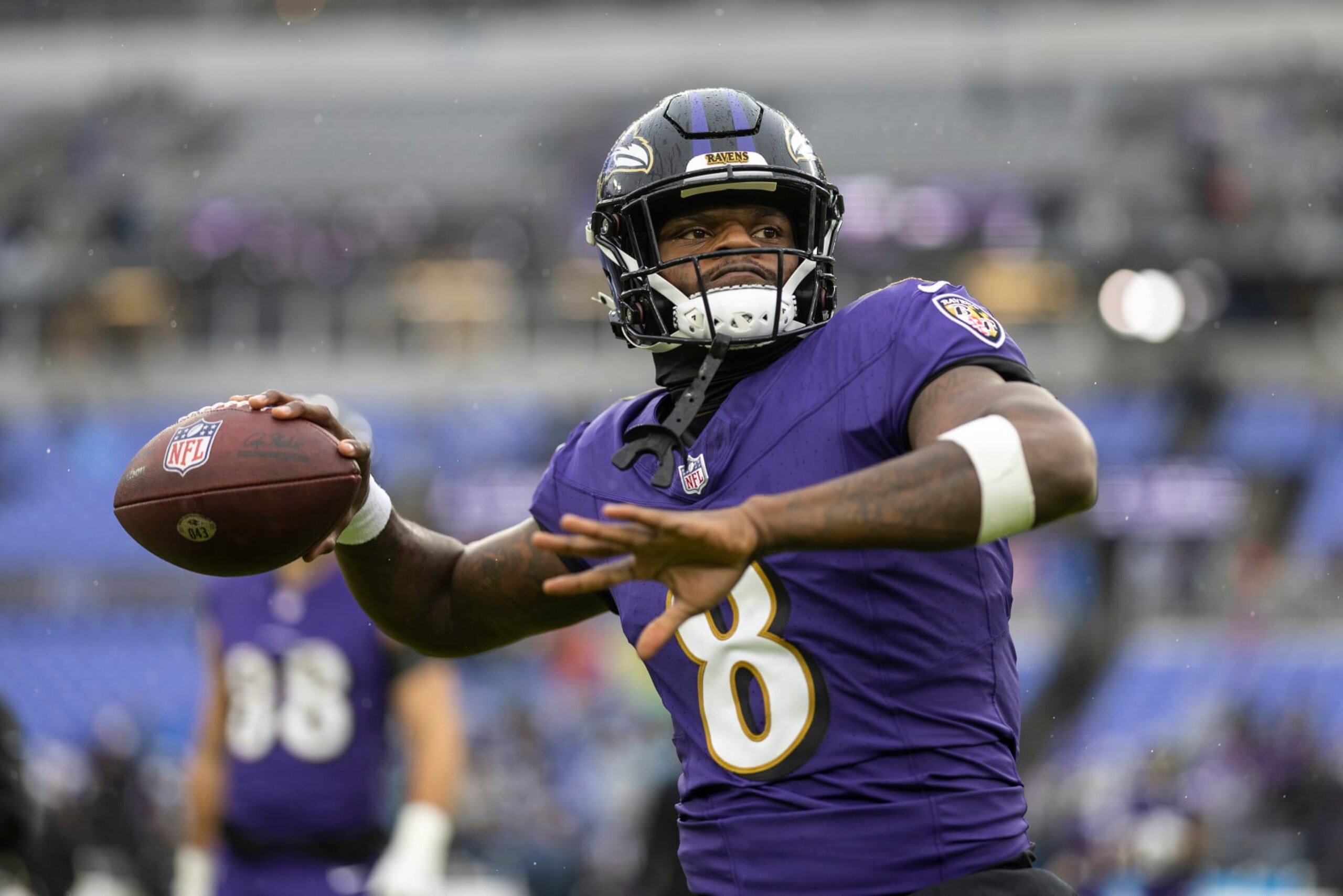 BALTIMORE, MARYLAND - DECEMBER 10: Lamar Jackson #8 of the Baltimore Ravens throws a pass as he warms up prior to an NFL football game between the Baltimore Ravens and the Los Angeles Rams at M&T Bank Stadium on December 10, 2023 in Baltimore, Maryland. (Photo by Michael Owens/Getty Images) BALTIMORE, MARYLAND - DECEMBER 10: Lamar Jackson #8 of the Baltimore Ravens throws a pass as he warms up prior to an NFL football game between the Baltimore Ravens and the Los Angeles Rams at M&T Bank Stadium on December 10, 2023 in Baltimore, Maryland. (Photo by Michael Owens/Getty Images)