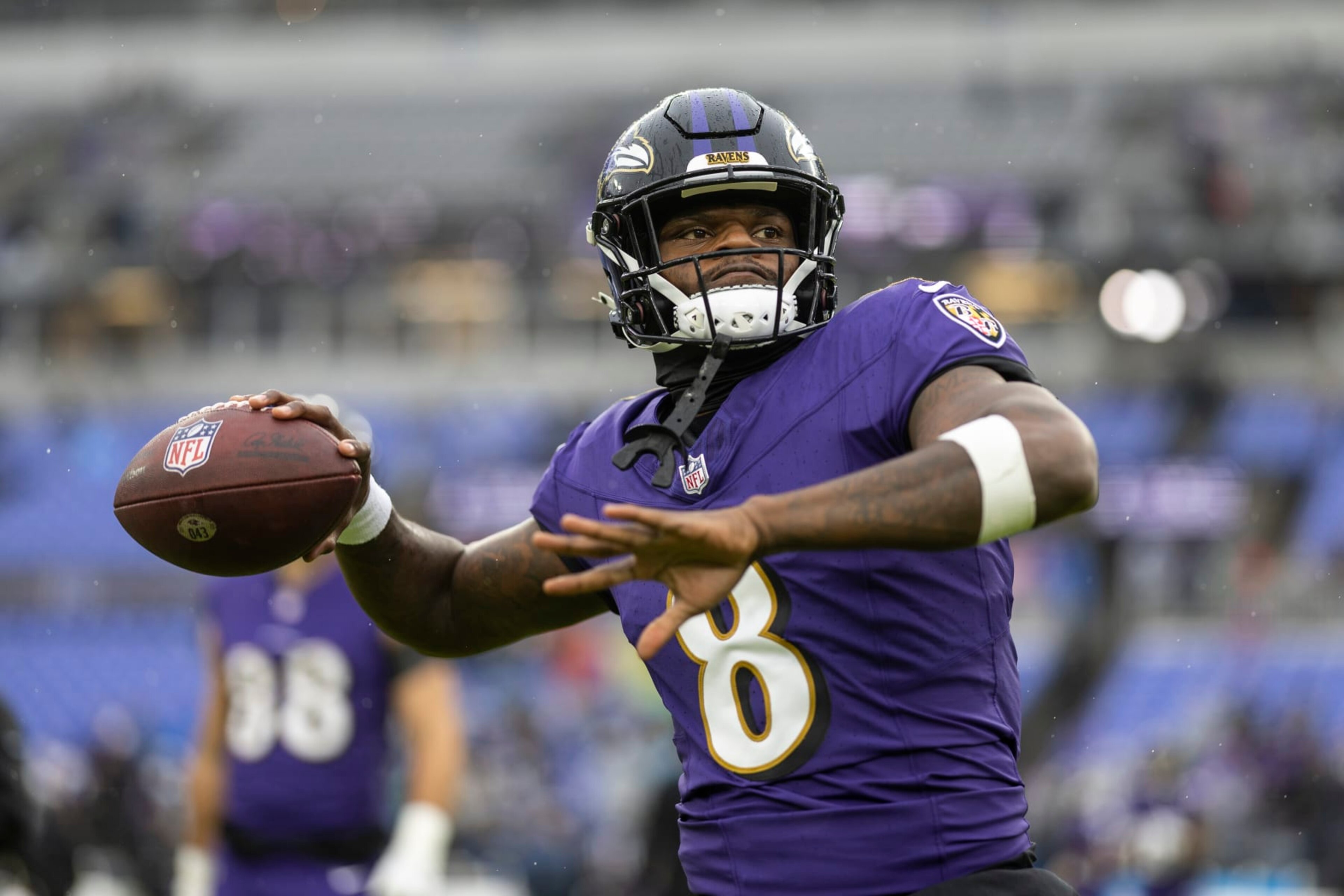 BALTIMORE, MARYLAND - DECEMBER 10: Lamar Jackson #8 of the Baltimore Ravens throws a pass as he warms up prior to an NFL football game between the Baltimore Ravens and the Los Angeles Rams at M&T Bank Stadium on December 10, 2023 in Baltimore, Maryland. (Photo by Michael Owens/Getty Images)