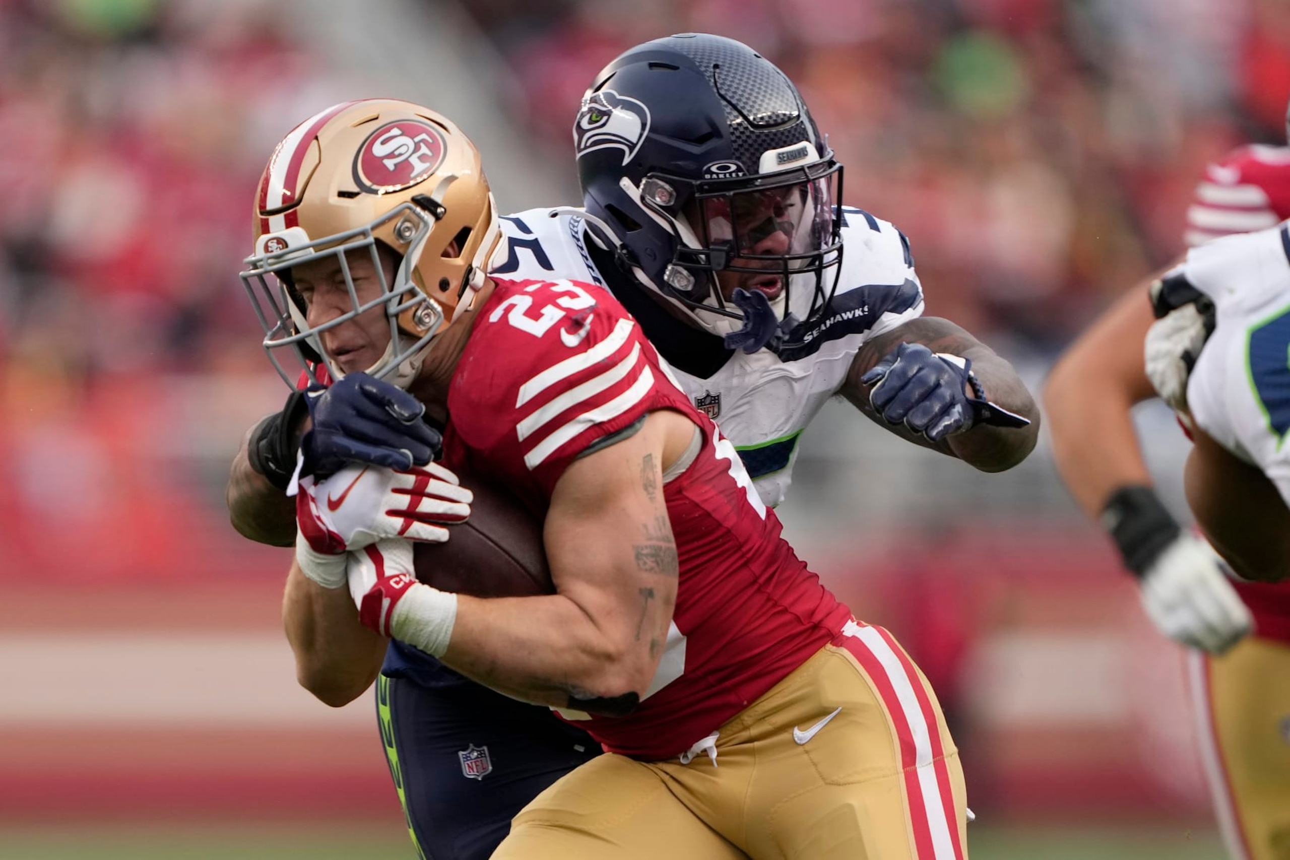 SANTA CLARA, CALIFORNIA - DECEMBER 10: Christian McCaffrey #23 of the San Francisco 49ers runs the ball during the third quarter in the game against the Seattle Seahawks at Levi's Stadium on December 10, 2023 in Santa Clara, California. (Photo by Thearon W. Henderson/Getty Images) SANTA CLARA, CALIFORNIA - DECEMBER 10: Christian McCaffrey #23 of the San Francisco 49ers runs the ball during the third quarter in the game against the Seattle Seahawks at Levi's Stadium on December 10, 2023 in Santa Clara, California. (Photo by Thearon W. Henderson/Getty Images)