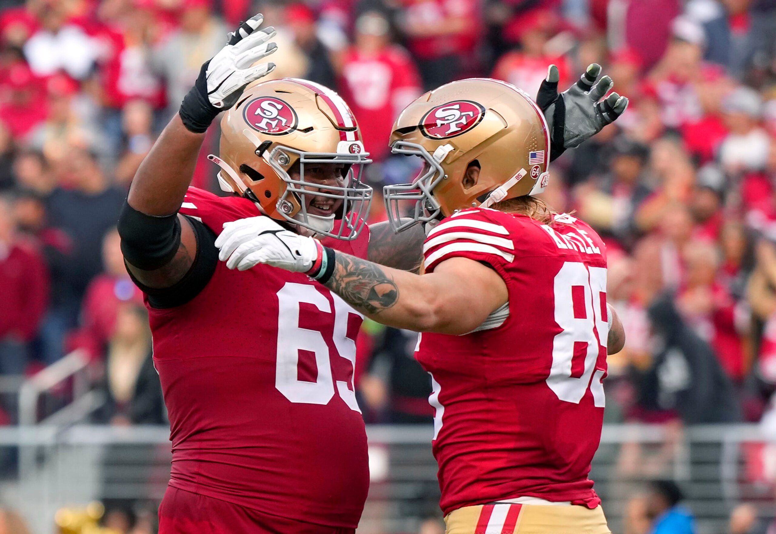 SANTA CLARA, CALIFORNIA - DECEMBER 10: George Kittle #85 and Aaron Banks #65 of the San Francisco 49ers celebrates after Kittle scored a touchdown during the fourth quarter in the game against the Seattle Seahawks at Levi's Stadium on December 10, 2023 in Santa Clara, California. (Photo by Thearon W. Henderson/Getty Images) SANTA CLARA, CALIFORNIA - DECEMBER 10: George Kittle #85 and Aaron Banks #65 of the San Francisco 49ers celebrates after Kittle scored a touchdown during the fourth quarter in the game against the Seattle Seahawks at Levi's Stadium on December 10, 2023 in Santa Clara, California. (Photo by Thearon W. Henderson/Getty Images)