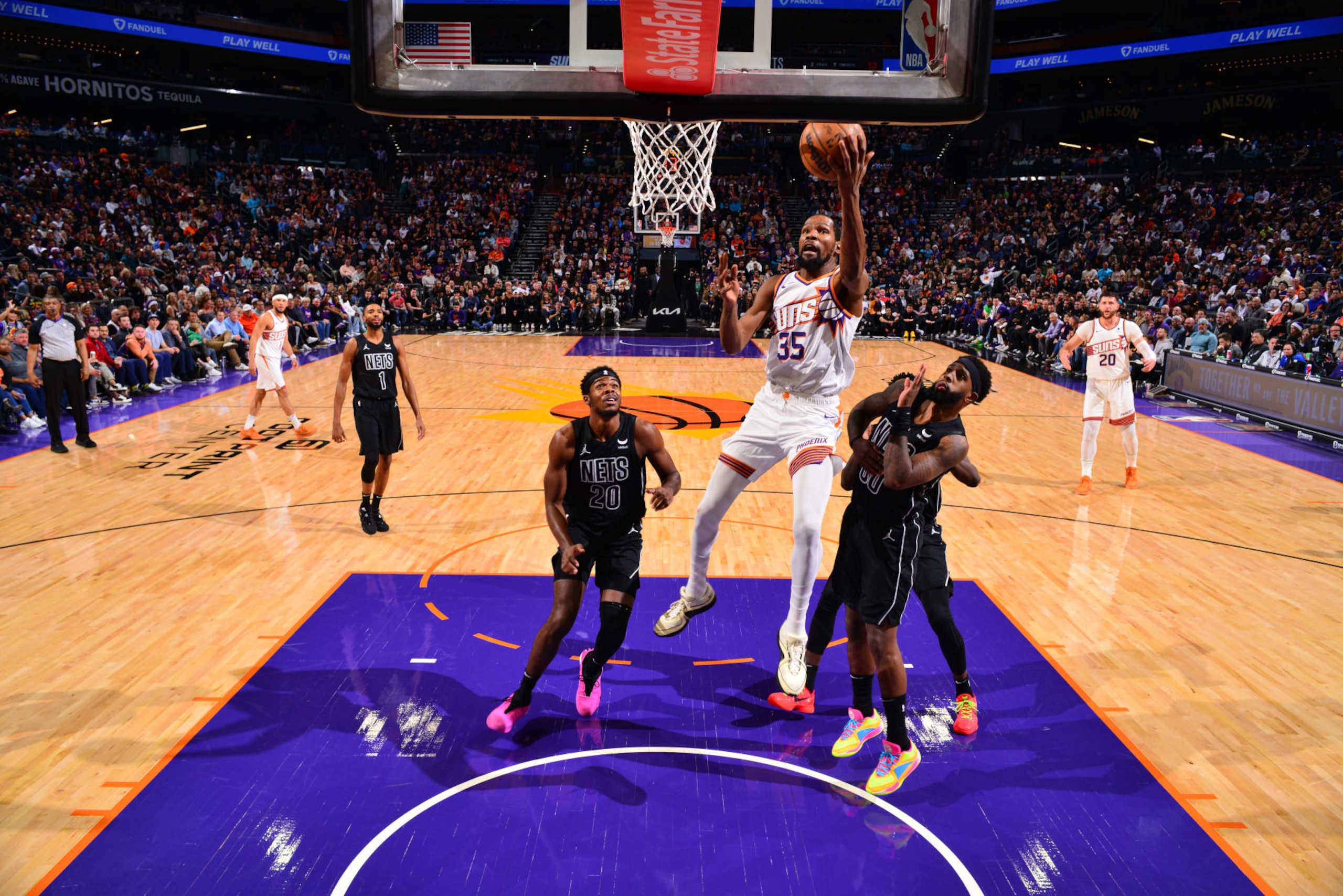PHOENIX, AZ - DECEMBER 13: Kevin Durant #35 of the Phoenix Suns drives to the basket during the game against the Brooklyn Nets on December 13, 2023 at Footprint Center in Phoenix, Arizona. NOTE TO USER: User expressly acknowledges and agrees that, by downloading and or using this photograph, user is consenting to the terms and conditions of the Getty Images License Agreement. Mandatory Copyright Notice: Copyright 2023 NBAE (Photo by Barry Gossage/NBAE via Getty Images)