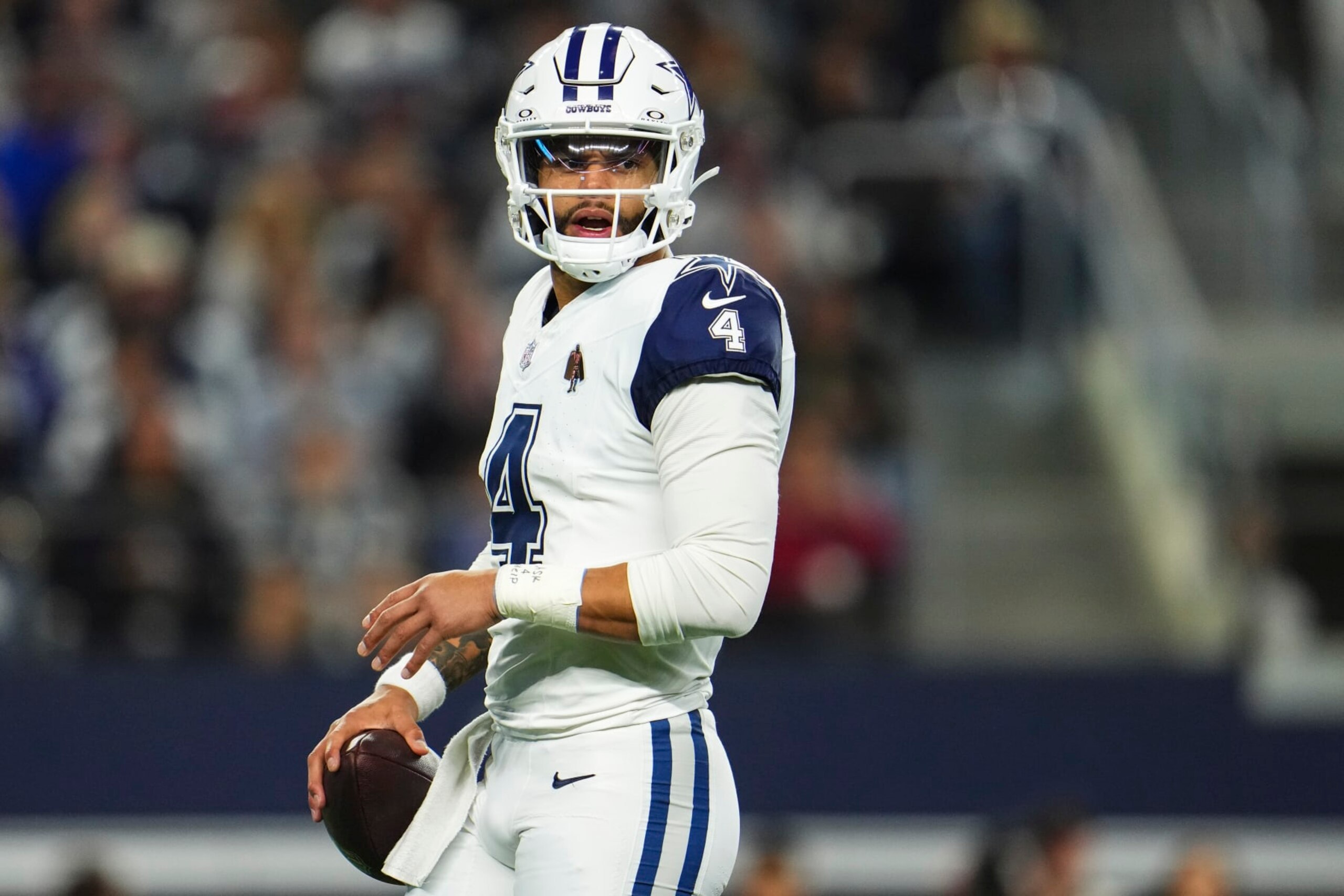 ARLINGTON, TX - DECEMBER 10: Dak Prescott #4 of the Dallas Cowboys looks on from the field during an NFL football game against the Philadelphia Eagles at AT&T Stadium on December 10, 2023 in Arlington, Texas. (Photo by Cooper Neill/Getty Images)