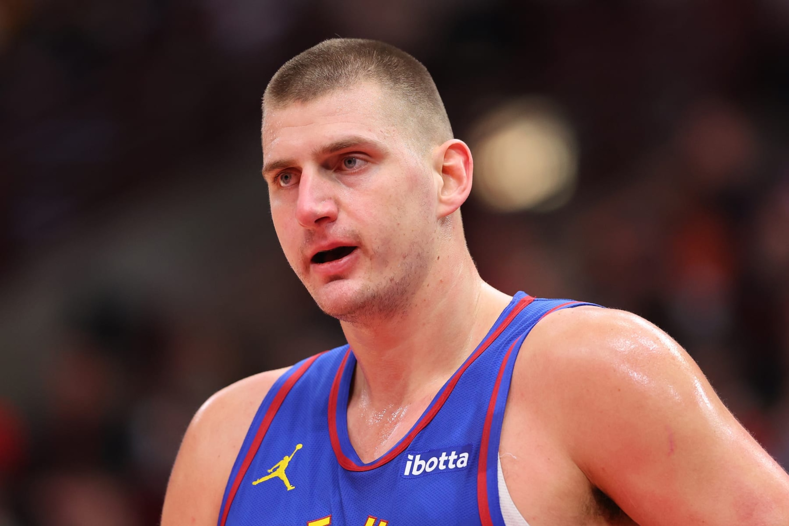 CHICAGO, ILLINOIS - DECEMBER 12: Nikola Jokic #15 of the Denver Nuggets reacts against the Chicago Bulls during the first half at the United Center on December 12, 2023 in Chicago, Illinois. NOTE TO USER: User expressly acknowledges and agrees that, by downloading and or using this photograph, User is consenting to the terms and conditions of the Getty Images License Agreement. (Photo by Michael Reaves/Getty Images) CHICAGO, ILLINOIS - DECEMBER 12: Nikola Jokic #15 of the Denver Nuggets reacts against the Chicago Bulls during the first half at the United Center on December 12, 2023 in Chicago, Illinois. NOTE TO USER: User expressly acknowledges and agrees that, by downloading and or using this photograph, User is consenting to the terms and conditions of the Getty Images License Agreement. (Photo by Michael Reaves/Getty Images)