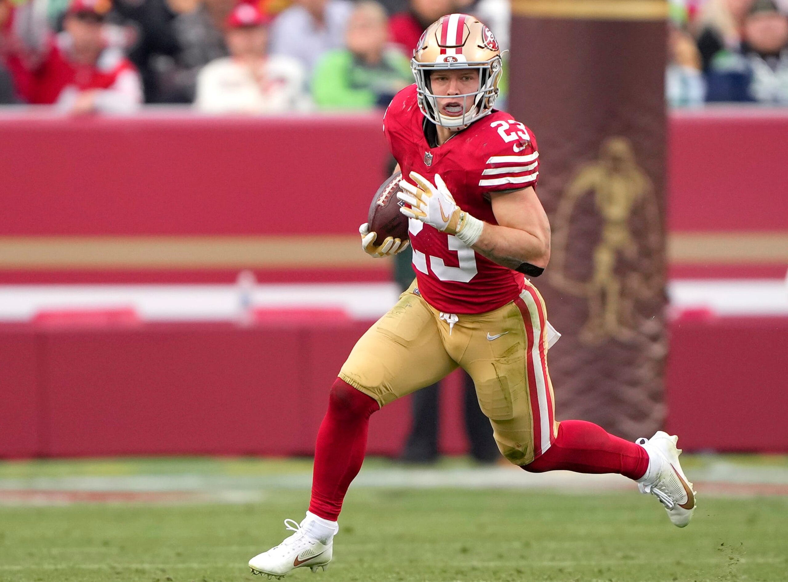 SANTA CLARA, CALIFORNIA - DECEMBER 10: Christian McCaffrey #23 of the San Francisco 49ers carries the ball against the Seattle Seahawks during the fourth quarter of an NFL football game at Levi's Stadium on December 10, 2023 in Santa Clara, California. (Photo by Thearon W. Henderson/Getty Images)