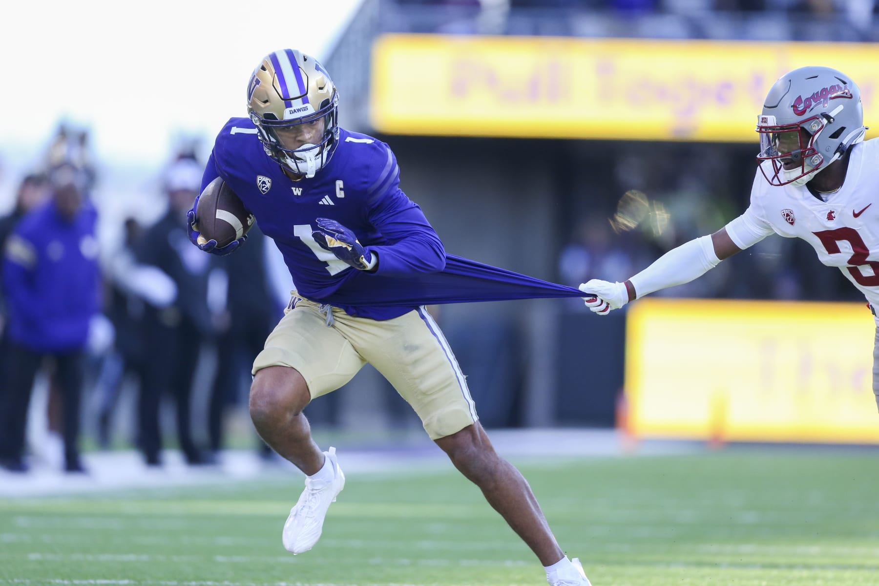 SEATTLE, WA - November 25:  Washington #1 (WR) Rome Odunze breaks up field as Washington State #3 (DB) Cam Lampkin hangs onto his jersey during the 115 Apple Cup college football game between the Washington Huskies and the Washington State Cougars on November 25, 2023, at Husky Stadium in Seattle, WA. (Photo by Jesse Beals/Icon Sportswire via Getty Images)