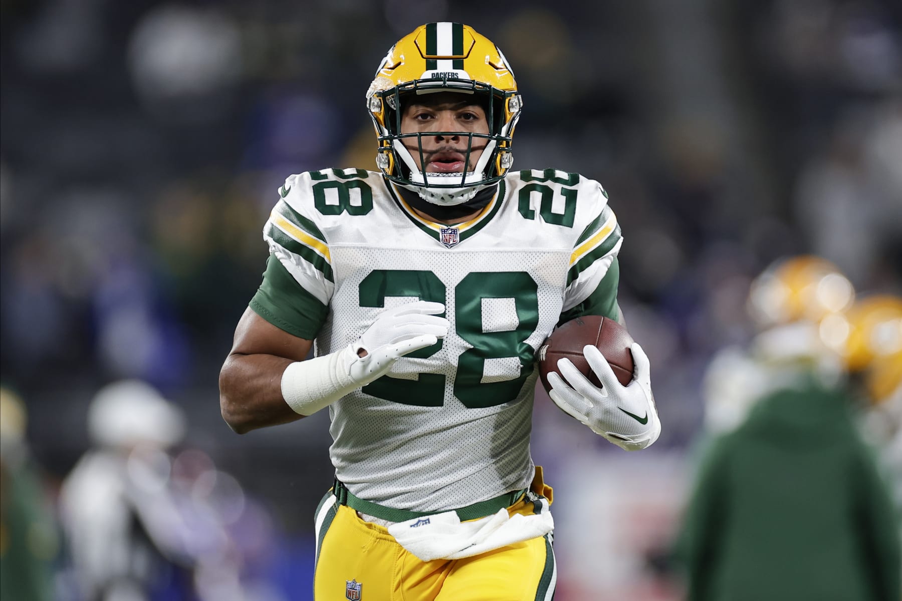 Green Bay Packers running back AJ Dillon (28) warms up before playing against the New York Giants in an NFL football game, Monday, Dec. 11, 2023, in East Rutherford, N.J. (AP Photo/Adam Hunger)