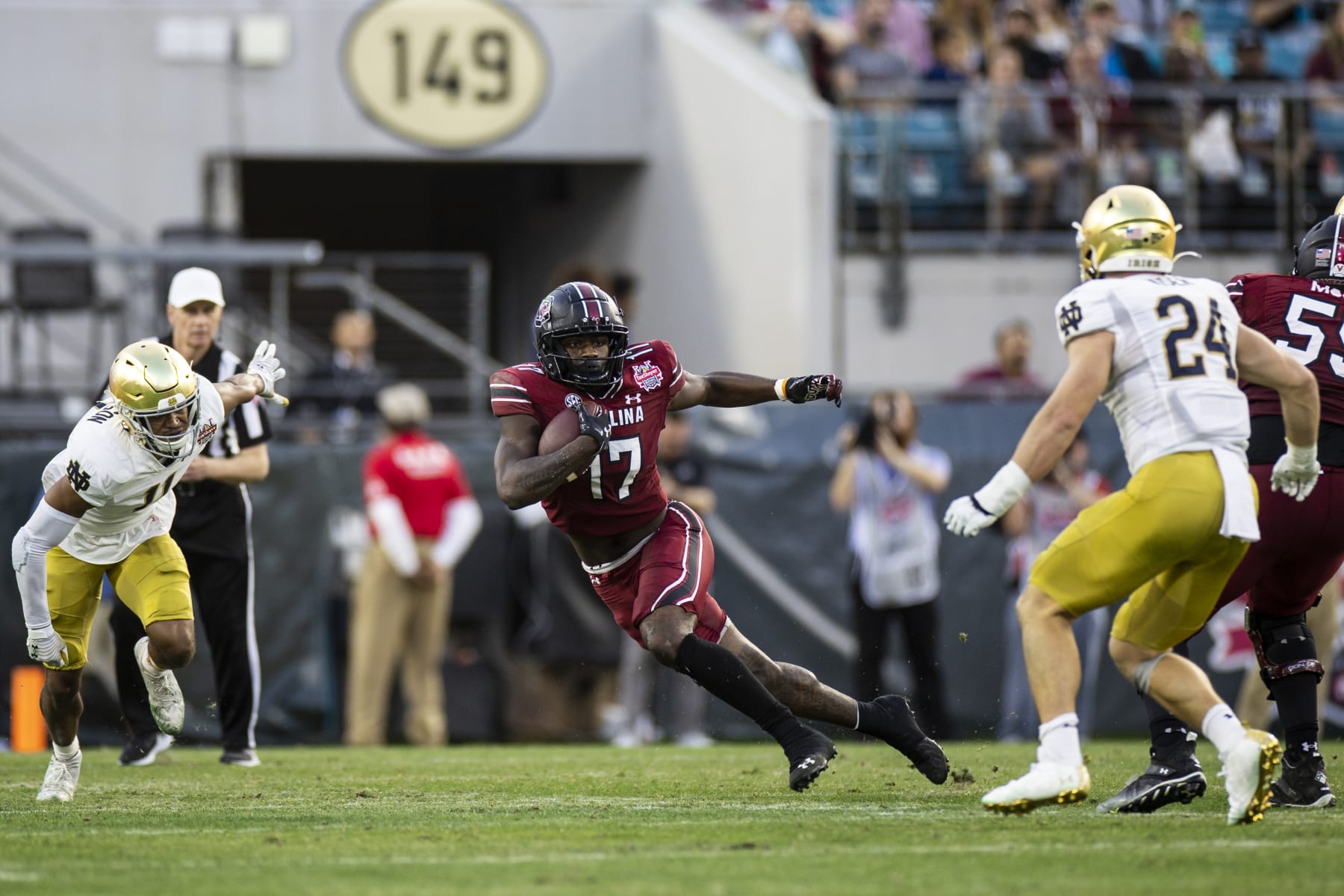 JACKSONVILLE, FLORIDA - DECEMBER 30: Xavier Legette #17 of the South Carolina Gamecocks runs the ball during the 2nd quarter of the TaxSlayer Gator Bowl against the Notre Dame Fighting Irish at TIAA Bank Field on December 30, 2022 in Jacksonville, Florida. (Photo by James Gilbert/Getty Images)