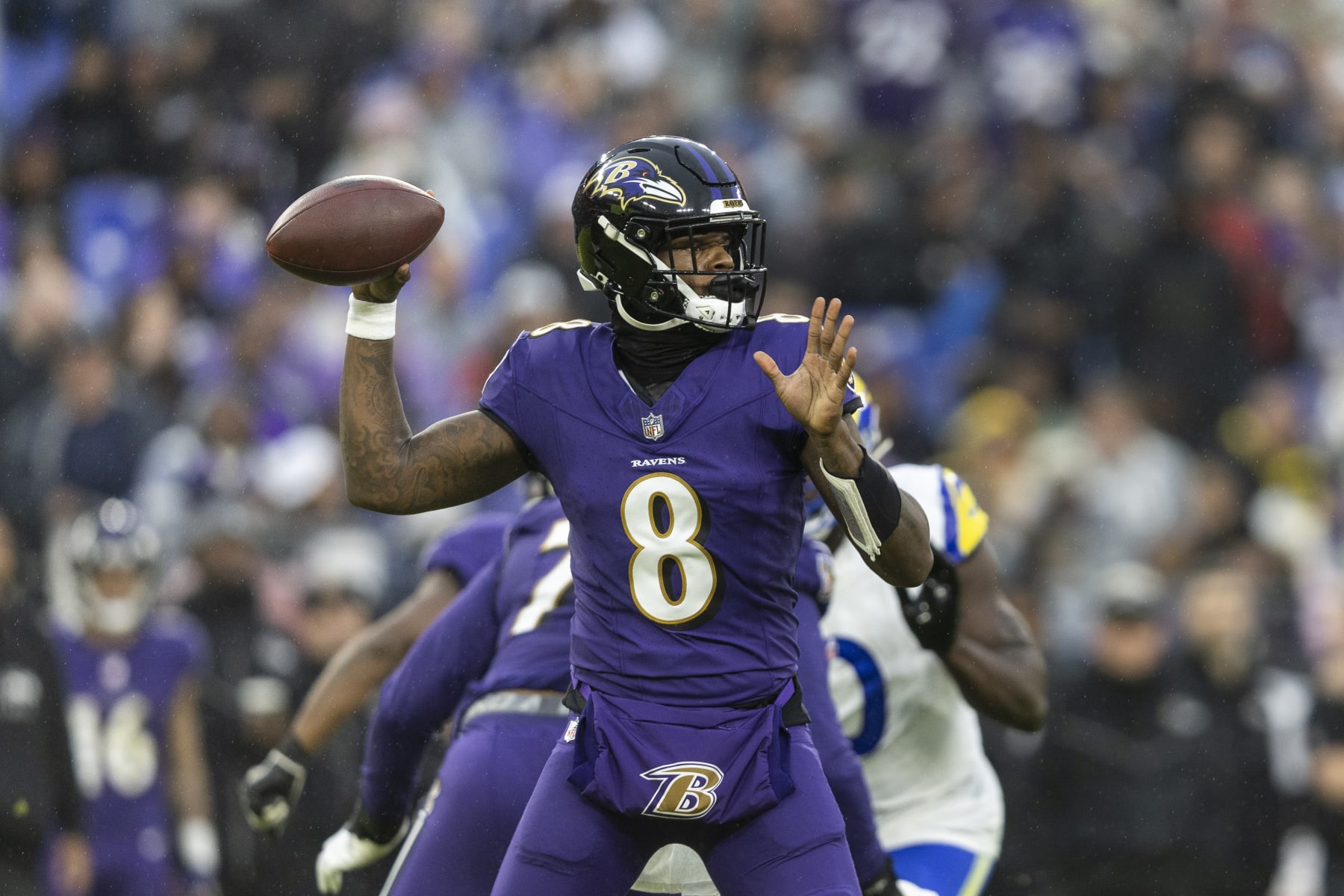 BALTIMORE, MARYLAND - DECEMBER 10: Lamar Jackson #8 of the Baltimore Ravens throws a pass during an NFL football game between the Baltimore Ravens and the Los Angeles Rams at M&T Bank Stadium on December 10, 2023 in Baltimore, Maryland. (Photo by Michael Owens/Getty Images)