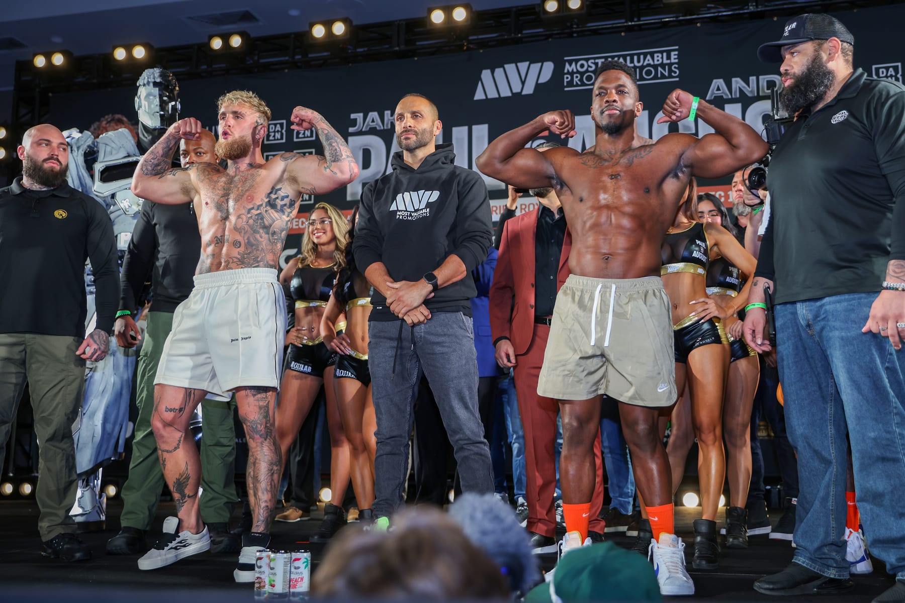 ORLANDO, FL - DECEMBER 14: Jake Paul and Andre August flex during the Jake Paul v Andre August - Weigh-in at the Caribe Royale Orlando on December 14, 2023 in Orlando, Florida. (Photo by Alex Menendez/Getty Images)