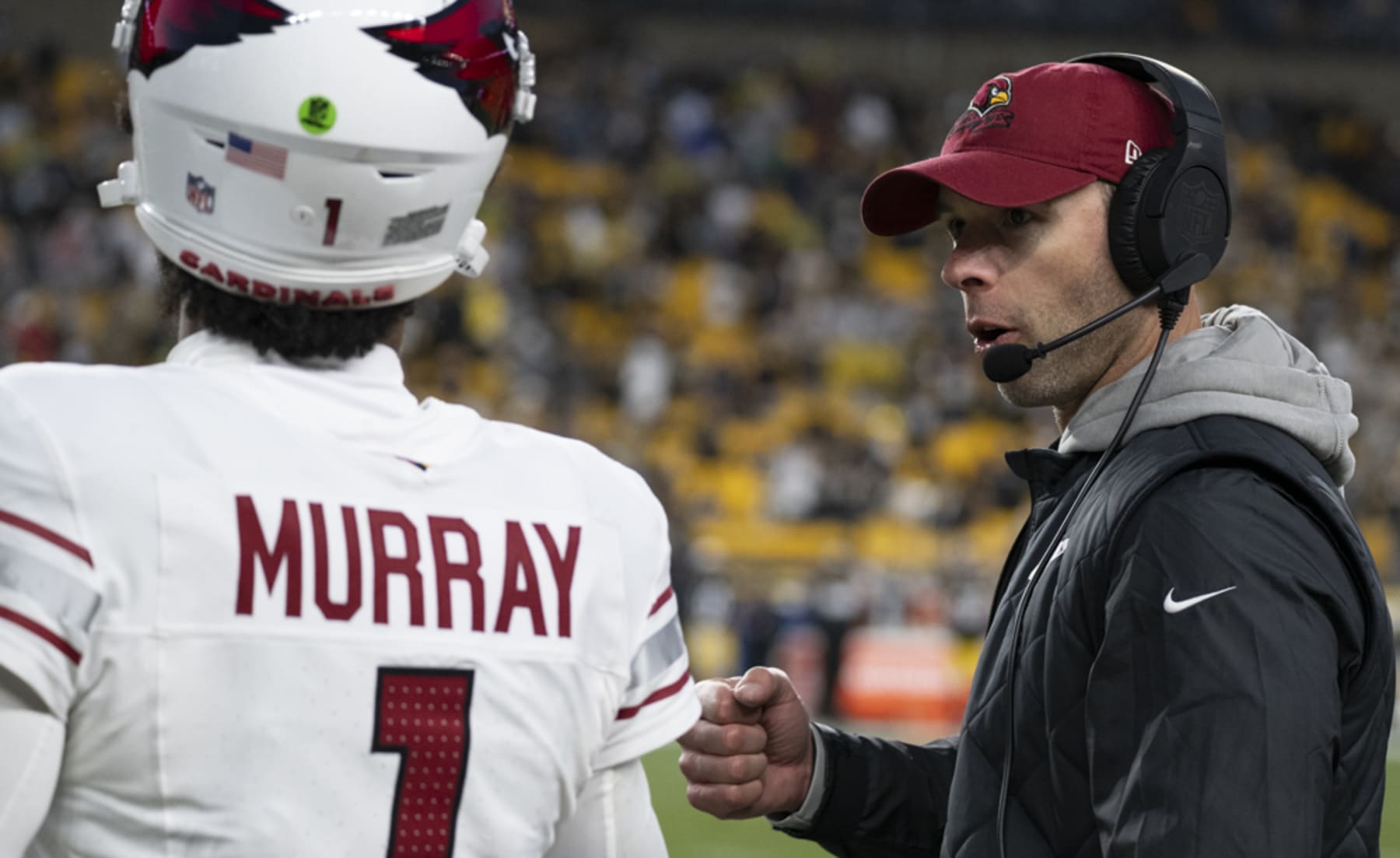 Head coach Jonathan Gannon talking to Kyler Murray