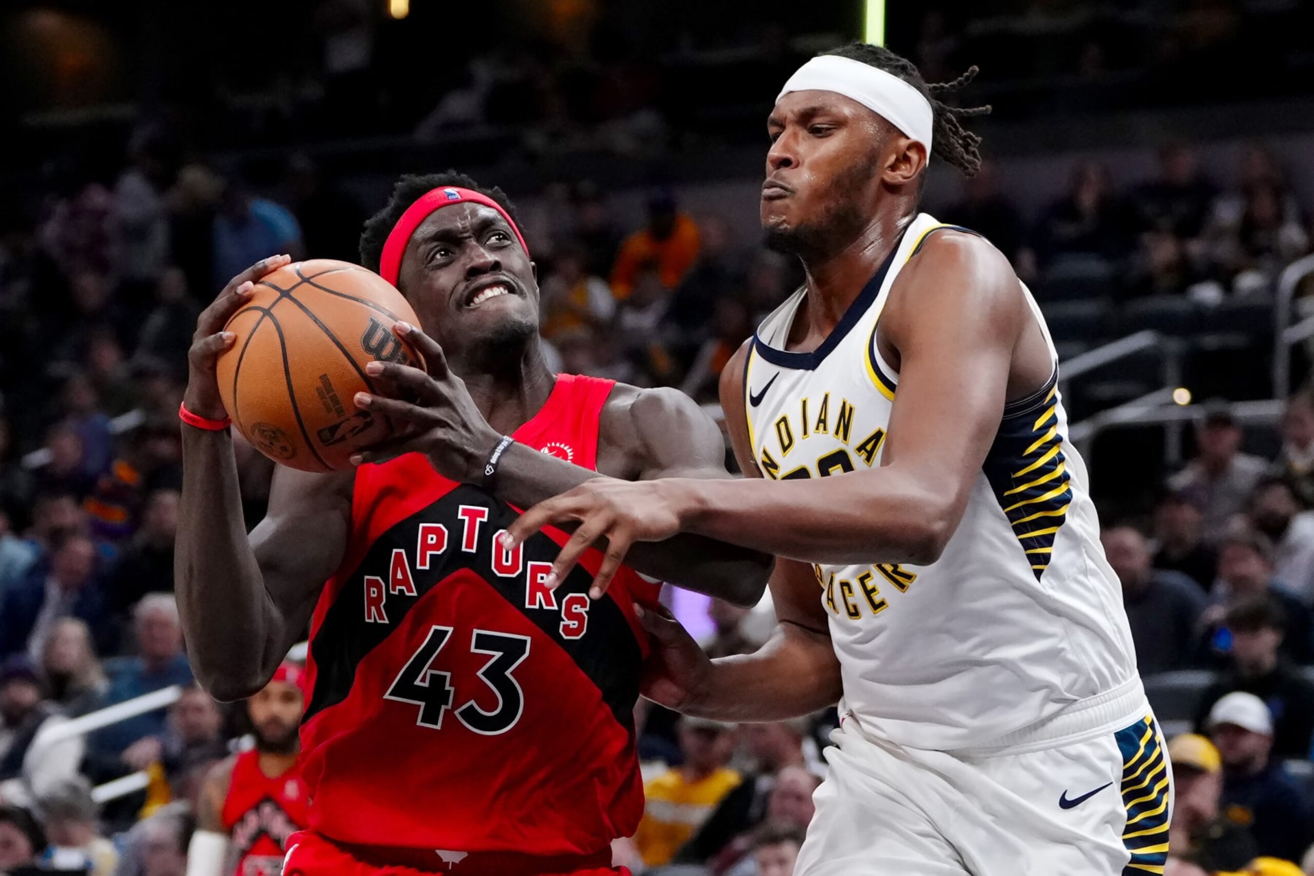 INDIANAPOLIS, INDIANA - NOVEMBER 22: Pascal Siakam #43 of the Toronto Raptors dribbles the ball while being guarded by Myles Turner #33 of the Indiana Pacers in the third quarter at Gainbridge Fieldhouse on November 22, 2023 in Indianapolis, Indiana. NOTE TO USER: User expressly acknowledges and agrees that, by downloading and or using this photograph, User is consenting to the terms and conditions of the Getty Images License Agreement. (Photo by Dylan Buell/Getty Images)