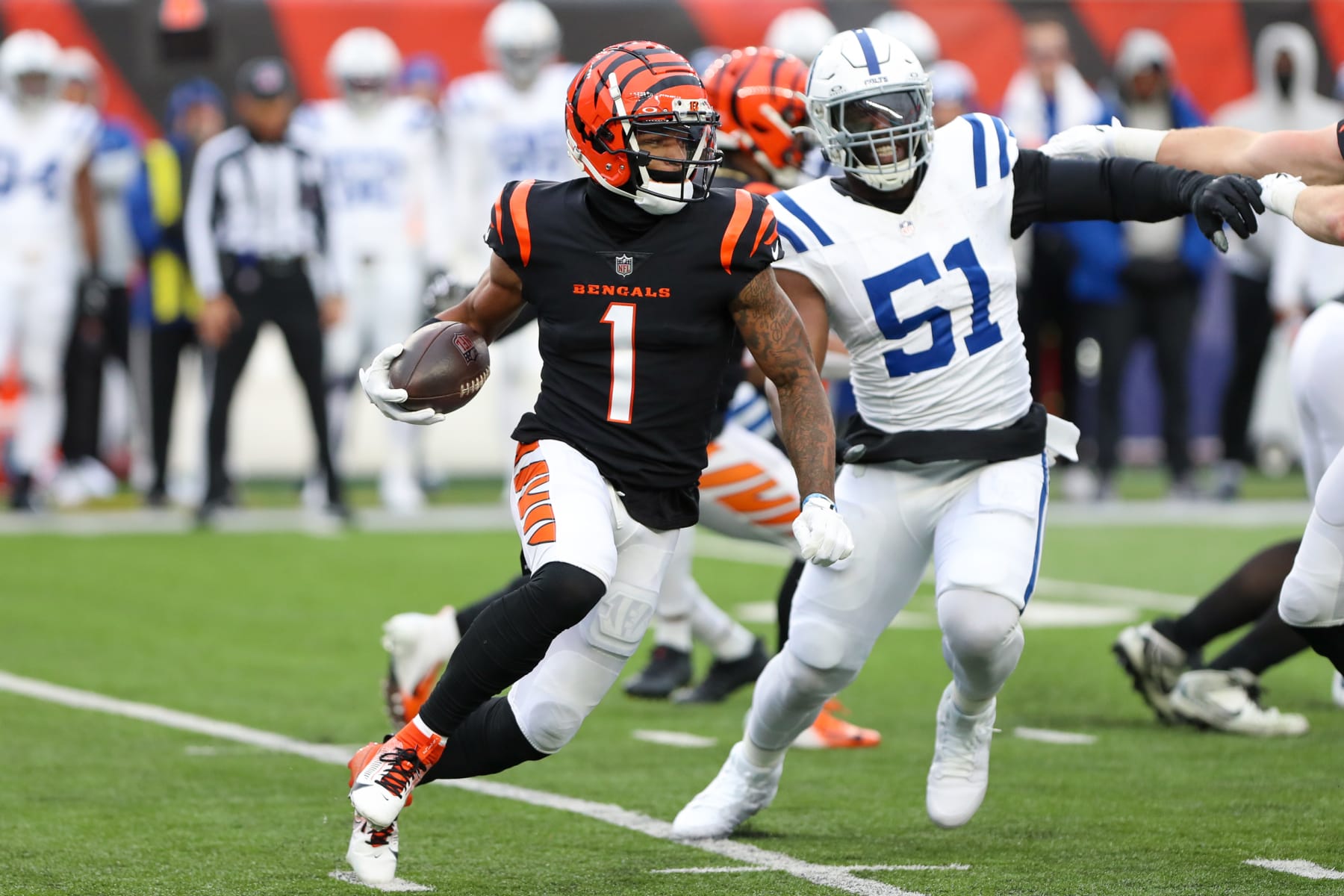 CINCINNATI, OH - DECEMBER 10: Cincinnati Bengals wide receiver Ja'Marr Chase (1) carries the ball during the game against the Indianapolis Colts and the Cincinnati Bengals on December 10, 2023, at Paycor Stadium in Cincinnati, OH. (Photo by Ian Johnson/Icon Sportswire via Getty Images)