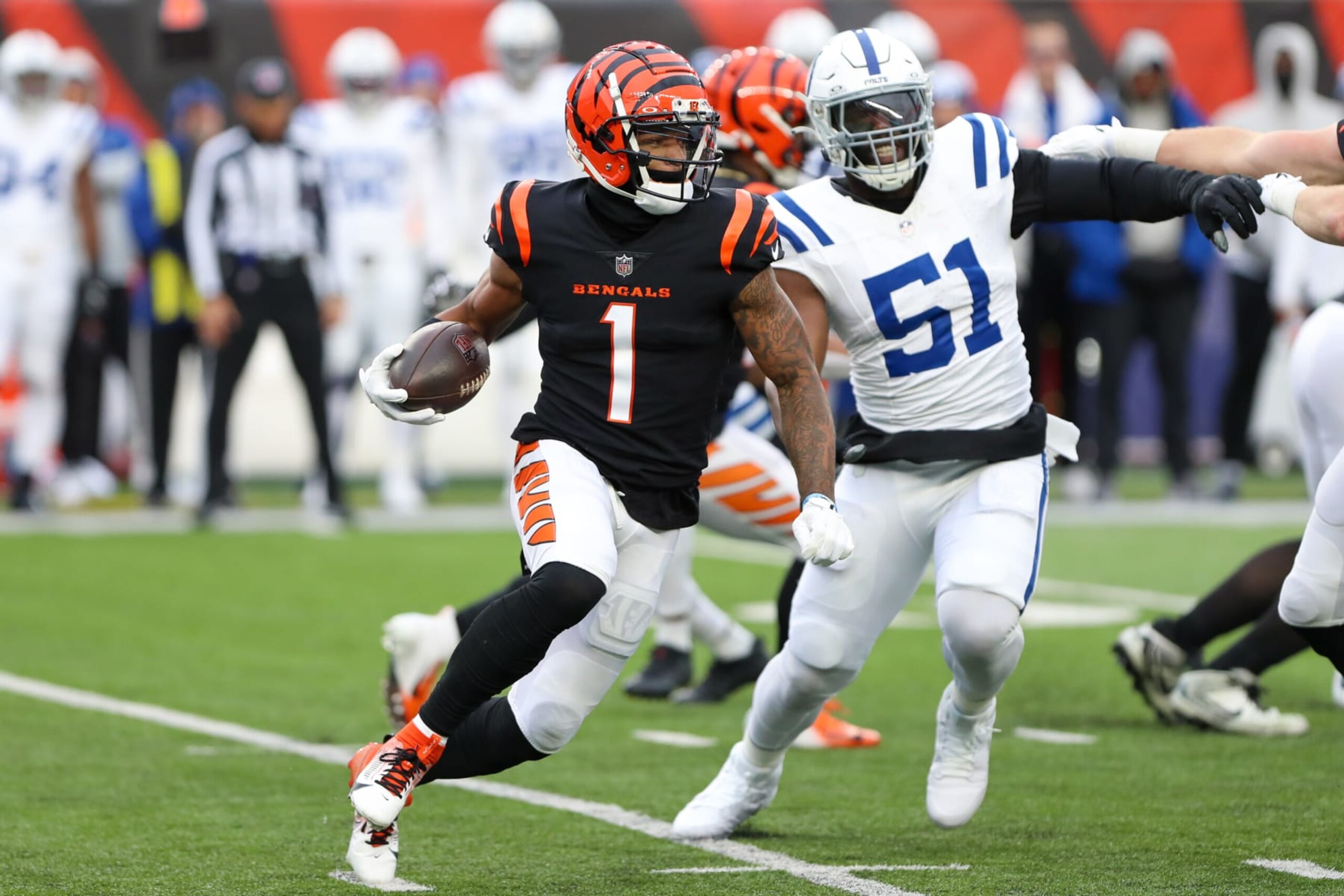 CINCINNATI, OH - DECEMBER 10: Cincinnati Bengals wide receiver Ja'Marr Chase (1) carries the ball during the game against the Indianapolis Colts and the Cincinnati Bengals on December 10, 2023, at Paycor Stadium in Cincinnati, OH. (Photo by Ian Johnson/Icon Sportswire via Getty Images)