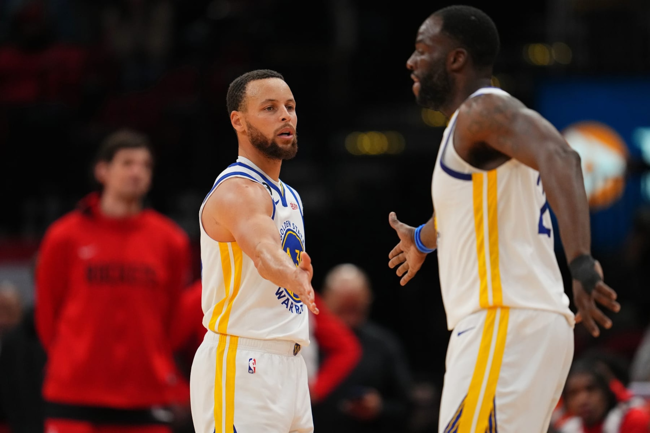 HOUSTON, TX - MARCH 20: Stephen Curry #30 of the Golden State Warriors high fives Draymond Green #23 of the Golden State Warriors during the game against the Houston Rockets on March 20, 2023 at the Toyota Center in Houston, Texas. NOTE TO USER: User expressly acknowledges and agrees that, by downloading and or using this photograph, User is consenting to the terms and conditions of the Getty Images License Agreement. Mandatory Copyright Notice: Copyright 2023 NBAE (Photo by Cooper Neill/NBAE via Getty Images)
