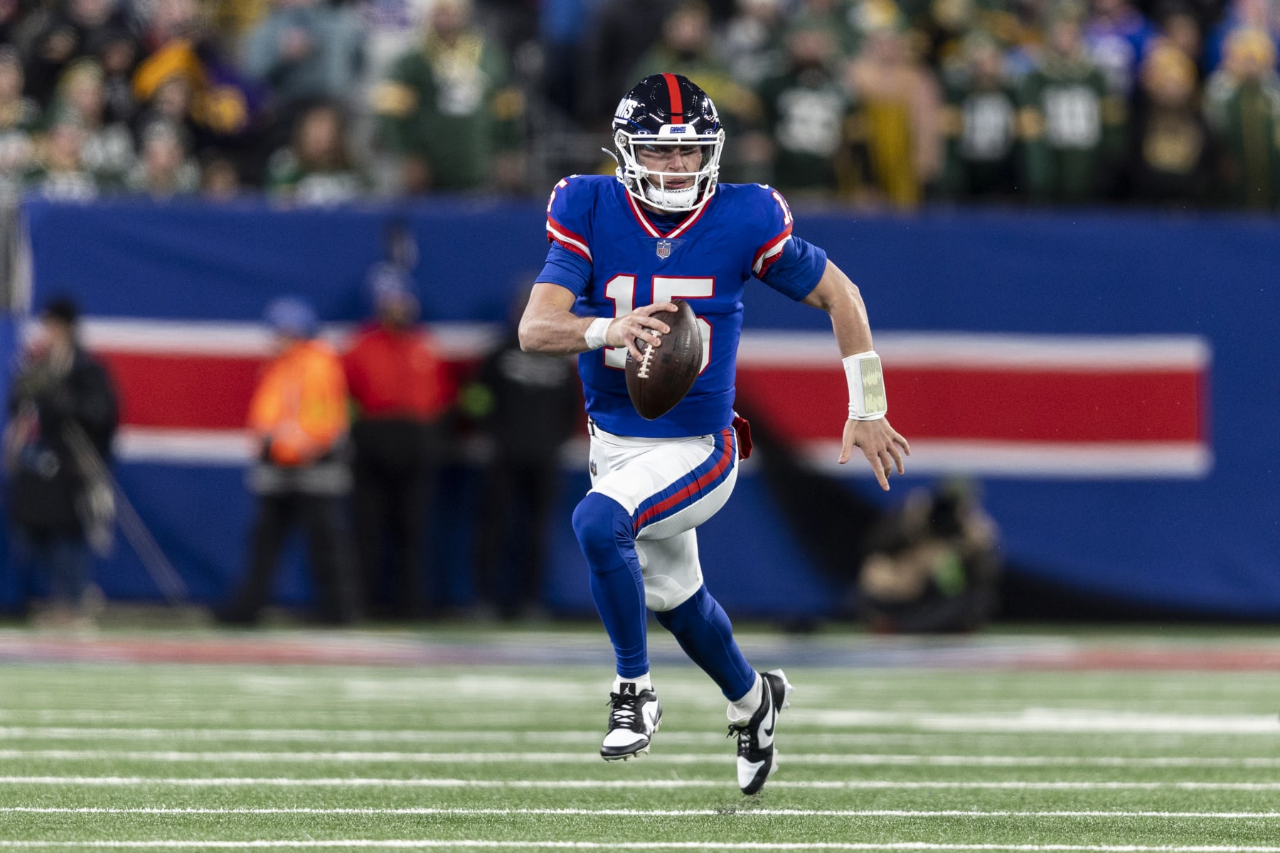 EAST RUTHERFORD, NEW JERSEY - DECEMBER 11: Tommy DeVito #15 of the New York Giants scrambles and looks to pass during an NFL football game between the New York Giants and the Green Bay Packers at MetLife Stadium on December 11, 2023 in East Rutherford, New Jersey. (Photo by Michael Owens/Getty Images)