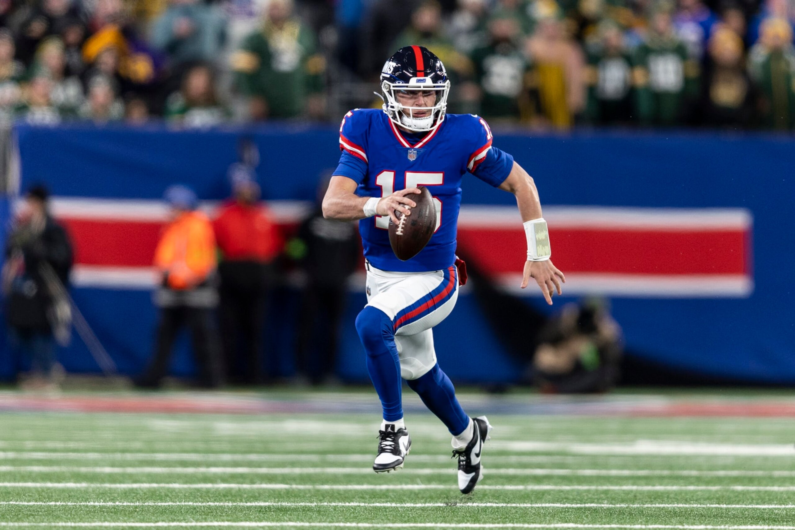 EAST RUTHERFORD, NEW JERSEY - DECEMBER 11: Tommy DeVito #15 of the New York Giants scrambles and looks to pass during an NFL football game between the New York Giants and the Green Bay Packers at MetLife Stadium on December 11, 2023 in East Rutherford, New Jersey. (Photo by Michael Owens/Getty Images)