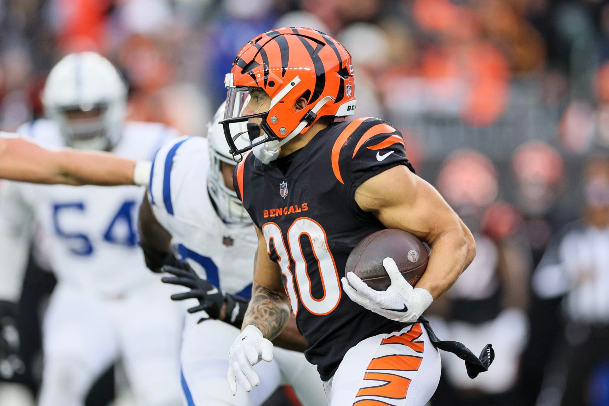 CINCINNATI, OHIO - DECEMBER 10: Chase Brown #30 of the Cincinnati Bengals carries the ball during the second half of the game against the Indianapolis Colts at Paycor Stadium on December 10, 2023 in Cincinnati, Ohio. (Photo by Andy Lyons/Getty Images)