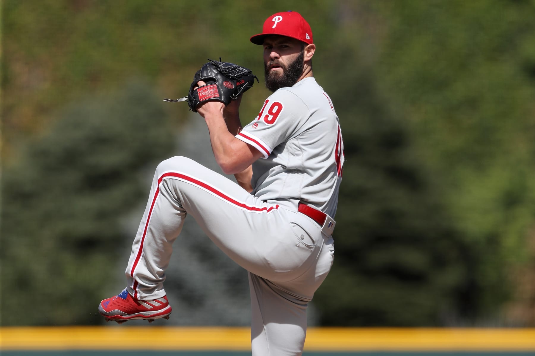 DENVER, CO - SEPTEMBER 27:  Starting pitcher Jake Arrieta #49 of the Philadelphia Phillies throws in the first inning against the Colorado Rockies at Coors Field on September 27, 2018 in Denver, Colorado.  (Photo by Matthew Stockman/Getty Images)