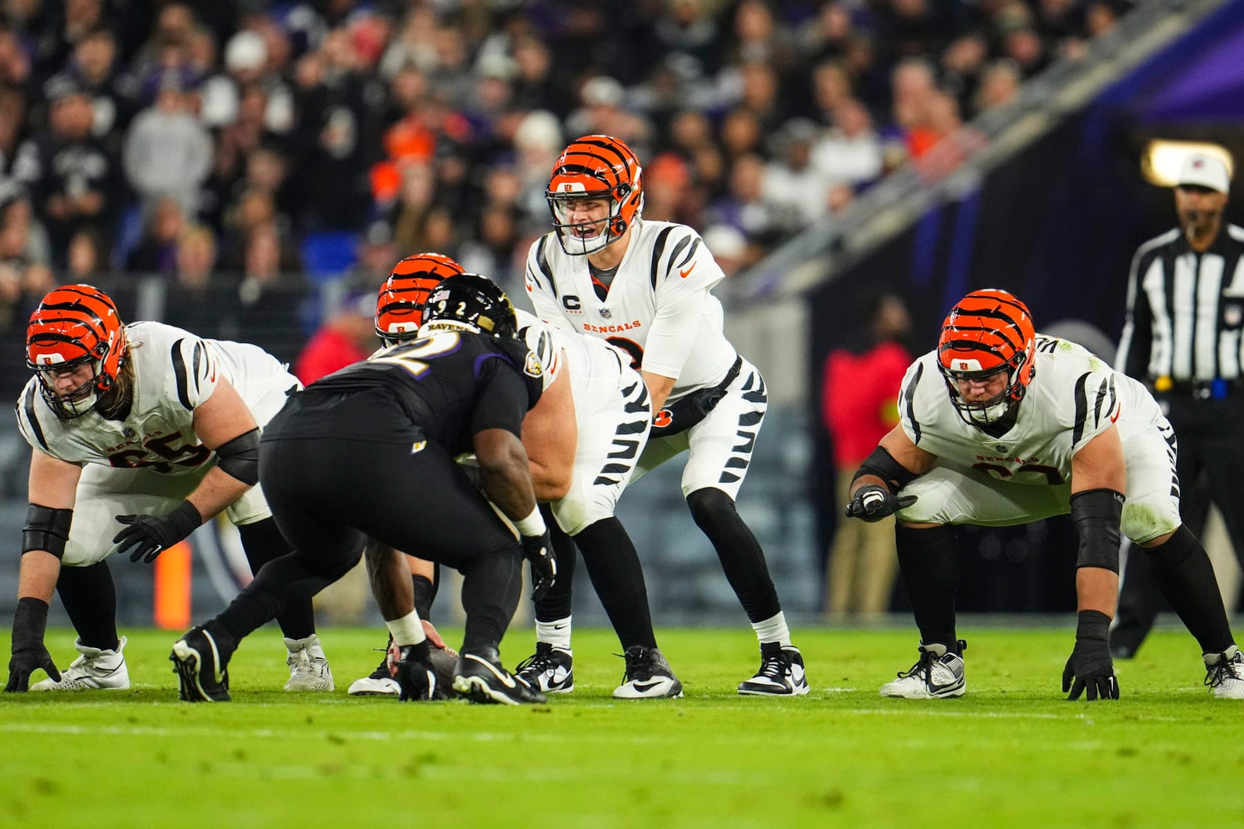BALTIMORE, MD - NOVEMBER 16: Joe Burrow #9 of the Cincinnati Bengals sets up under center during an NFL football game against the Baltimore Ravens at M&T Bank Stadium on November 16, 2023 in Baltimore, Maryland. (Photo by Cooper Neill/Getty Images) BALTIMORE, MD - NOVEMBER 16: Joe Burrow #9 of the Cincinnati Bengals sets up under center during an NFL football game against the Baltimore Ravens at M&T Bank Stadium on November 16, 2023 in Baltimore, Maryland. (Photo by Cooper Neill/Getty Images)