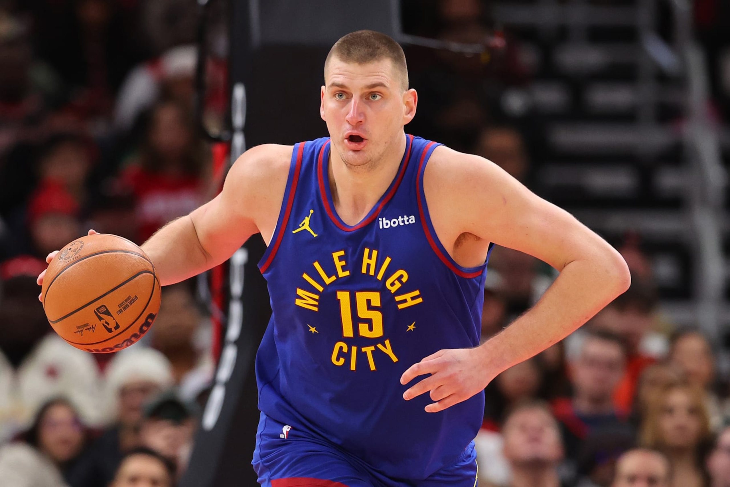 CHICAGO, ILLINOIS - DECEMBER 12: Nikola Jokic #15 of the Denver Nuggets dribbles up the court against the Chicago Bulls during the first half at the United Center on December 12, 2023 in Chicago, Illinois. NOTE TO USER: User expressly acknowledges and agrees that, by downloading and or using this photograph, User is consenting to the terms and conditions of the Getty Images License Agreement. (Photo by Michael Reaves/Getty Images) CHICAGO, ILLINOIS - DECEMBER 12: Nikola Jokic #15 of the Denver Nuggets dribbles up the court against the Chicago Bulls during the first half at the United Center on December 12, 2023 in Chicago, Illinois. NOTE TO USER: User expressly acknowledges and agrees that, by downloading and or using this photograph, User is consenting to the terms and conditions of the Getty Images License Agreement. (Photo by Michael Reaves/Getty Images)