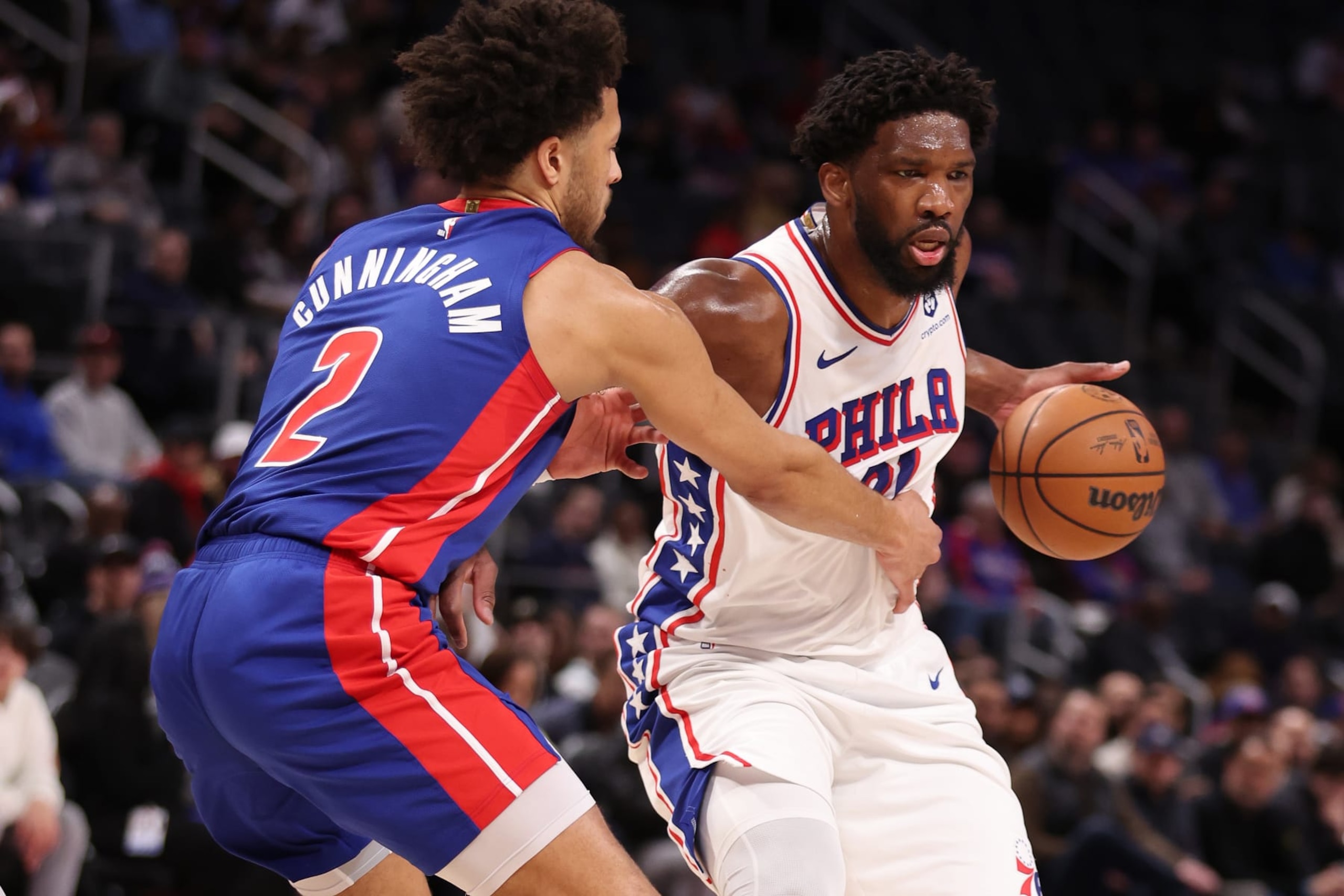 DETROIT, MICHIGAN - DECEMBER 13: Joel Embiid #21 of the Philadelphia 76ers drives around Cade Cunningham #2 of the Detroit Pistons during the first half at Little Caesars Arena on December 13, 2023 in Detroit, Michigan. NOTE TO USER: User expressly acknowledges and agrees that, by downloading and or using this photograph, User is consenting to the terms and conditions of the Getty Images License Agreement. (Photo by Gregory Shamus/Getty Images) DETROIT, MICHIGAN - DECEMBER 13: Joel Embiid #21 of the Philadelphia 76ers drives around Cade Cunningham #2 of the Detroit Pistons during the first half at Little Caesars Arena on December 13, 2023 in Detroit, Michigan. NOTE TO USER: User expressly acknowledges and agrees that, by downloading and or using this photograph, User is consenting to the terms and conditions of the Getty Images License Agreement. (Photo by Gregory Shamus/Getty Images)
