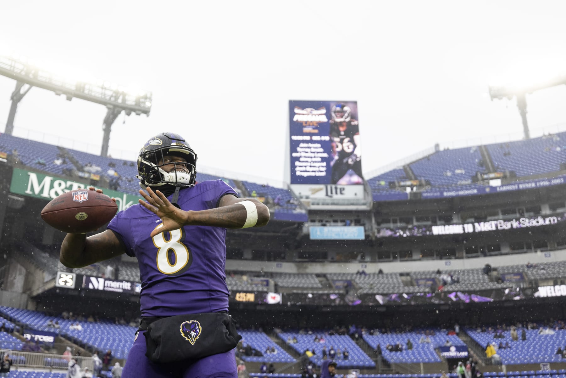 BALTIMORE, MARYLAND - DECEMBER 10: Lamar Jackson #8 of the Baltimore Ravens throws a pass as he warms up prior to an NFL football game between the Baltimore Ravens and the Los Angeles Rams at M&T Bank Stadium on December 10, 2023 in Baltimore, Maryland. (Photo by Michael Owens/Getty Images)