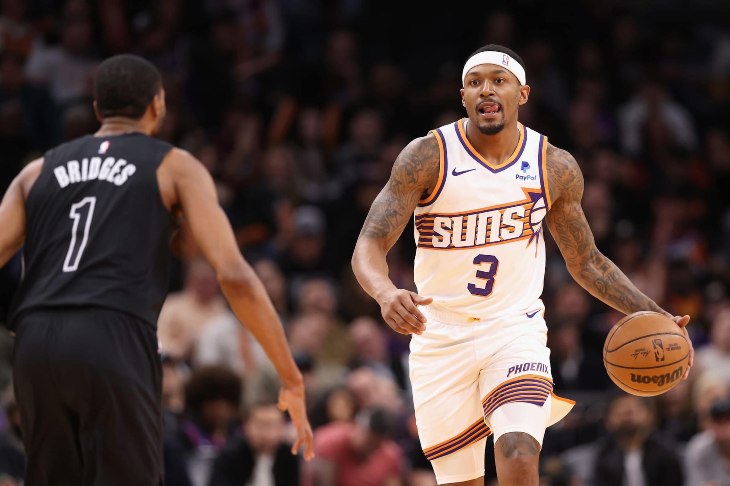 PHOENIX, ARIZONA - DECEMBER 13: Bradley Beal #3 of the Phoenix Suns handles the ball against Mikal Bridges #1 of the Brooklyn Nets during the first half of the NBA game at Footprint Center on December 13, 2023 in Phoenix, Arizona. NOTE TO USER: User expressly acknowledges and agrees that, by downloading and or using this photograph, User is consenting to the terms and conditions of the Getty Images License Agreement. (Photo by Christian Petersen/Getty Images) PHOENIX, ARIZONA - DECEMBER 13: Bradley Beal #3 of the Phoenix Suns handles the ball against Mikal Bridges #1 of the Brooklyn Nets during the first half of the NBA game at Footprint Center on December 13, 2023 in Phoenix, Arizona. NOTE TO USER: User expressly acknowledges and agrees that, by downloading and or using this photograph, User is consenting to the terms and conditions of the Getty Images License Agreement. (Photo by Christian Petersen/Getty Images)