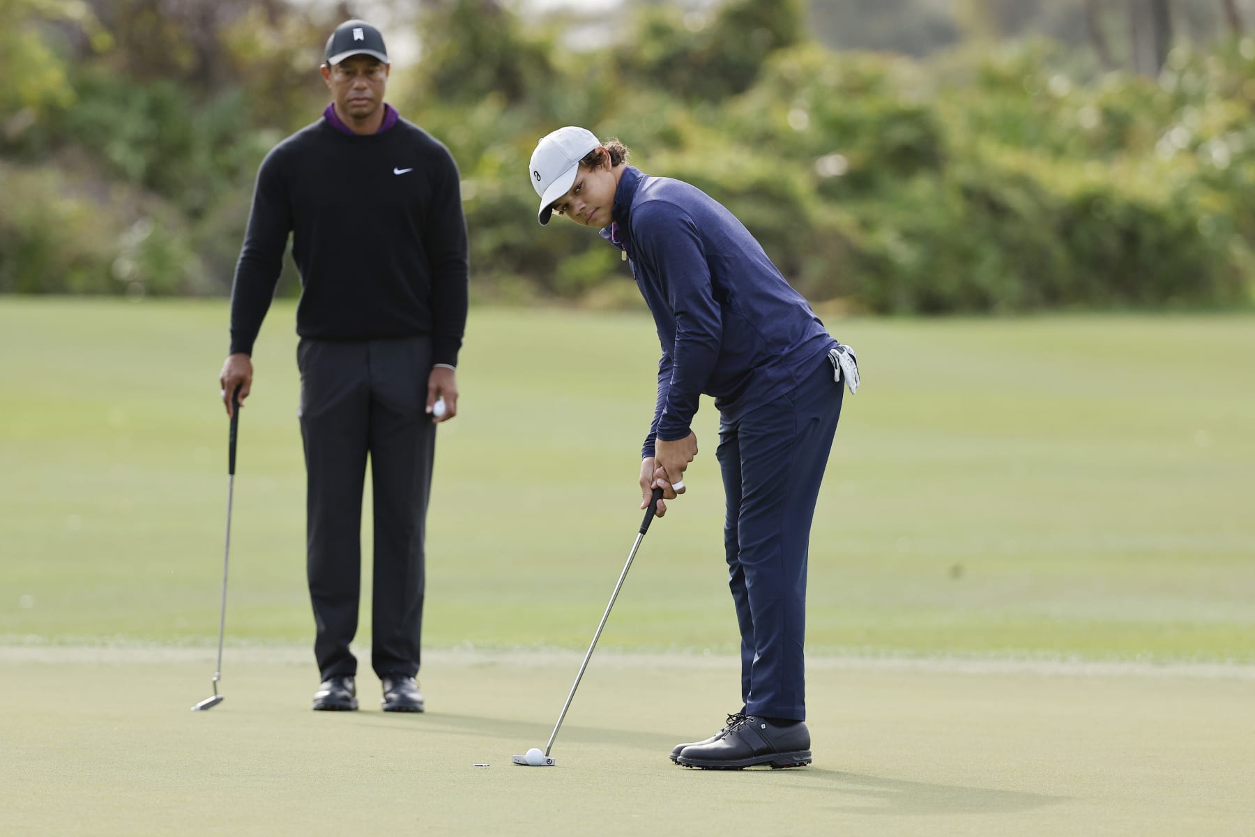 ORLANDO, FLORIDA - DECEMBER 15: Charlie Woods son of Tiger Woods of the United States putts on the third green during the pro-am prior to the PNC Championship at The Ritz-Carlton Golf Club on December 15, 2023 in Orlando, Florida. (Photo by Mike Mulholland/Getty Images)