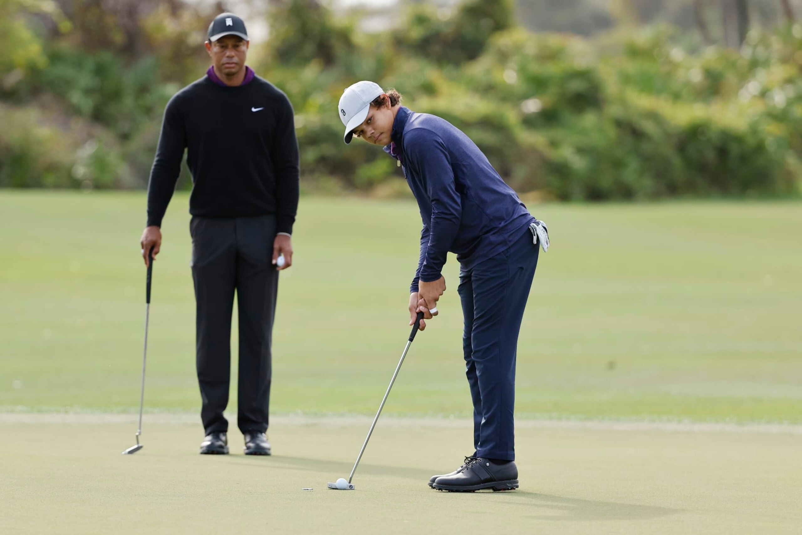 ORLANDO, FLORIDA - DECEMBER 15: Charlie Woods son of Tiger Woods of the United States putts on the third green during the pro-am prior to the PNC Championship at The Ritz-Carlton Golf Club on December 15, 2023 in Orlando, Florida. (Photo by Mike Mulholland/Getty Images)