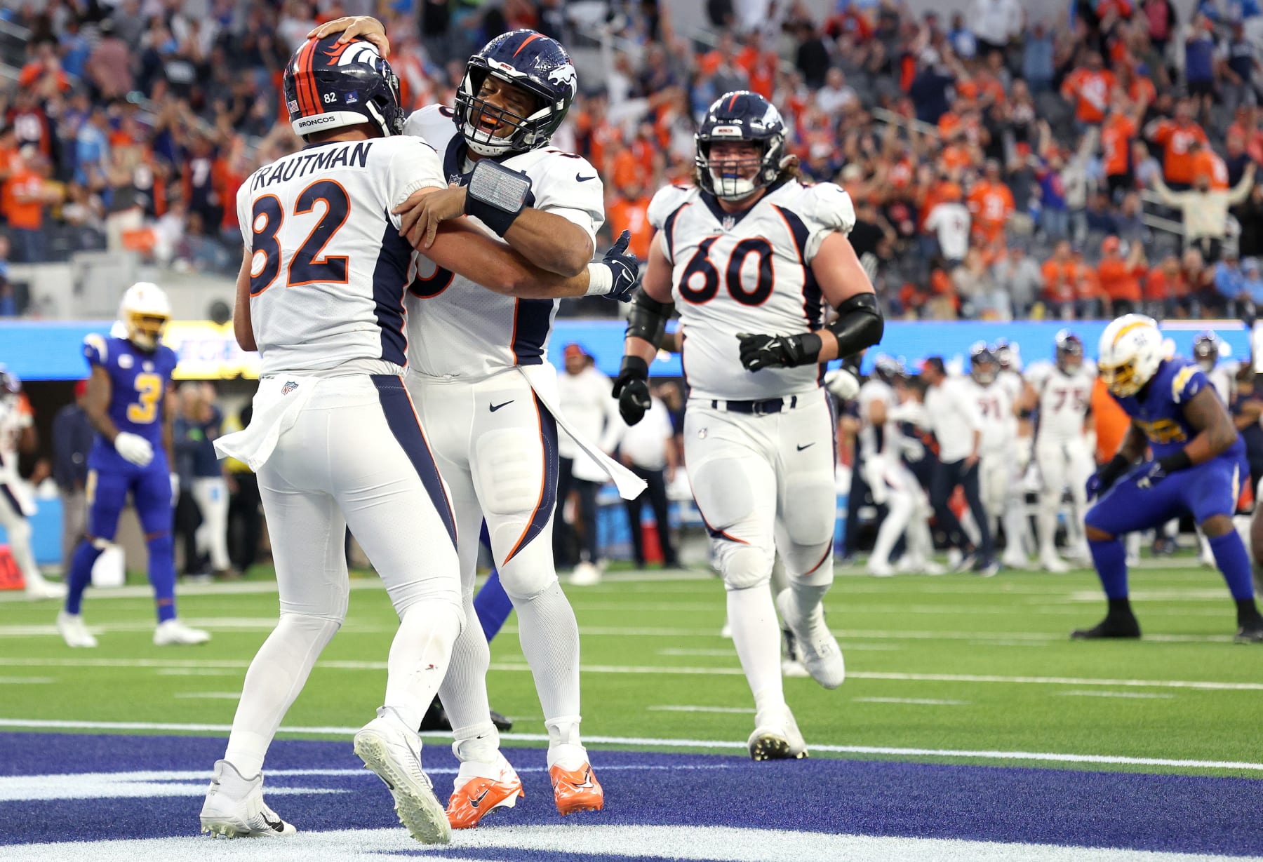 INGLEWOOD, CALIFORNIA - DECEMBER 10: Russell Wilson #3 of the Denver Broncos celebrates a touchdown pass with Adam Trautman #82 of the Denver Broncos during the fourth quarter against the Los Angeles Chargers at SoFi Stadium on December 10, 2023 in Inglewood, California. (Photo by Harry How/Getty Images)