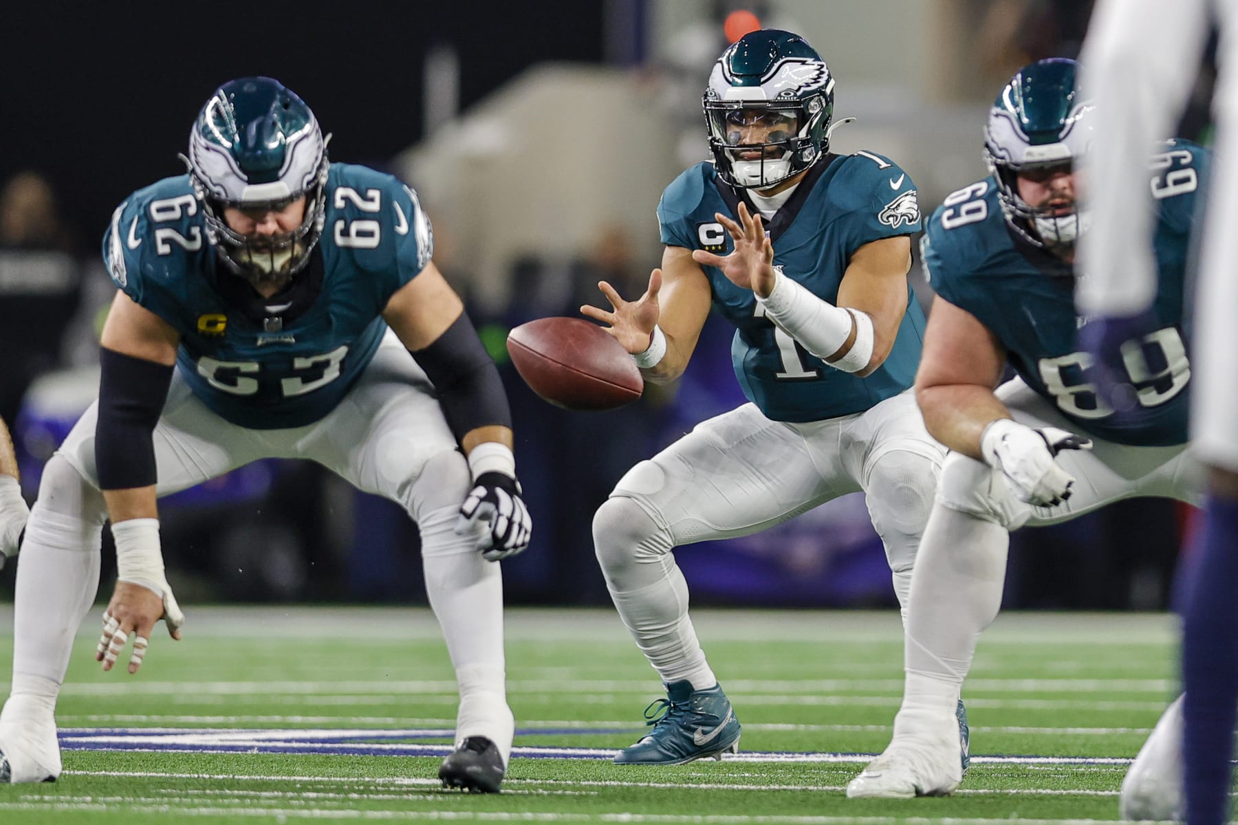 ARLINGTON, TX - DECEMBER 10: Philadelphia Eagles quarterback Jalen Hurts (1) takes the football from center Jason Kelce (62) during the game between the Dallas Cowboys and the Philadelphia Eagles on December 10, 2023 at AT&T Stadium in Arlington, Texas. (Photo by Matthew Pearce/Icon Sportswire via Getty Images)