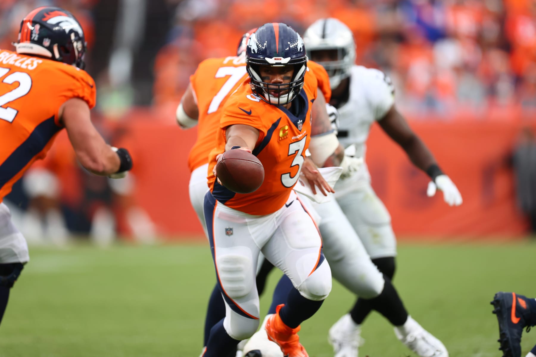Football: Denver Broncos quarterback Russell Wilson (3) in action, hands the ball off vs. Las Vegas Raiders at Empower Field at Mile High Stadium. 
Denver, CO 9/10/2023 
CREDIT: Jamie Schwaberow (Photo by Jamie Schwaberow/Sports Illustrated via Getty Images) 
(Set Number: X164422 TK1)