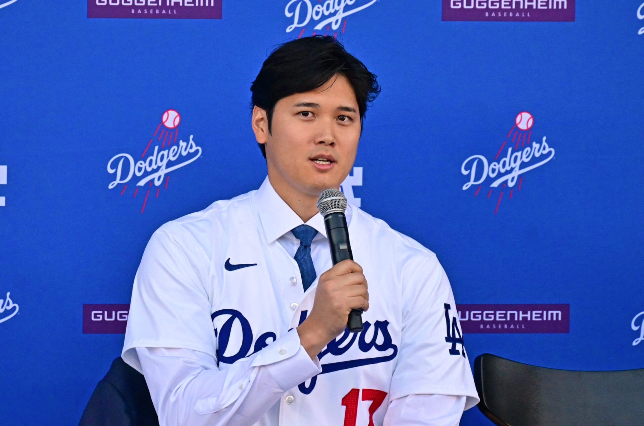 Japanese baseball player Shohei Ohtani speaks during a press conference on his presentation after signing a ten-year deal with the Los Angeles Dodgers at Dodgers Stadium in Los Angeles, California on December 14, 2023. Ohtani has signed a record-shattering $700 million deal with the Los Angeles Dodgers, the richest in North American sports history. (Photo by Frederic J. Brown / AFP) (Photo by FREDERIC J. BROWN/AFP via Getty Images)