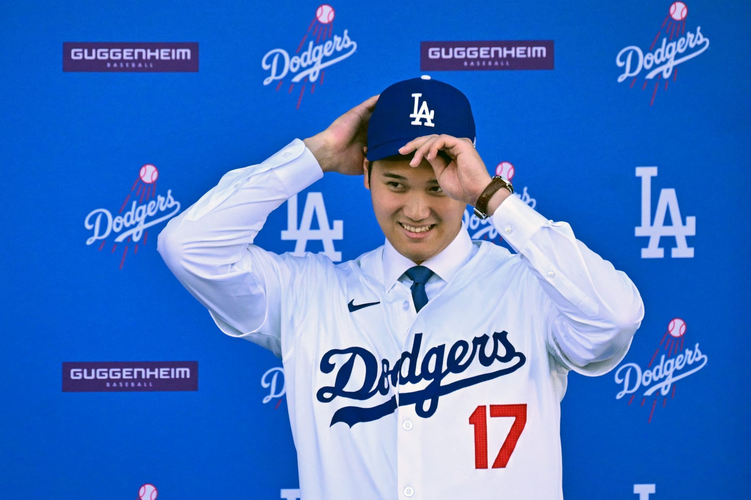 TOPSHOT - Japanese baseball player Shohei Ohtani attends a press conference on his presentation after signing a ten-year deal with the Los Angeles Dodgers at Dodgers Stadium in Los Angeles, California on December 14, 2023. Ohtani has signed a record-shattering $700 million deal with the Los Angeles Dodgers, the richest in North American sports history. (Photo by Frederic J. Brown / AFP) (Photo by FREDERIC J. BROWN/AFP via Getty Images)
