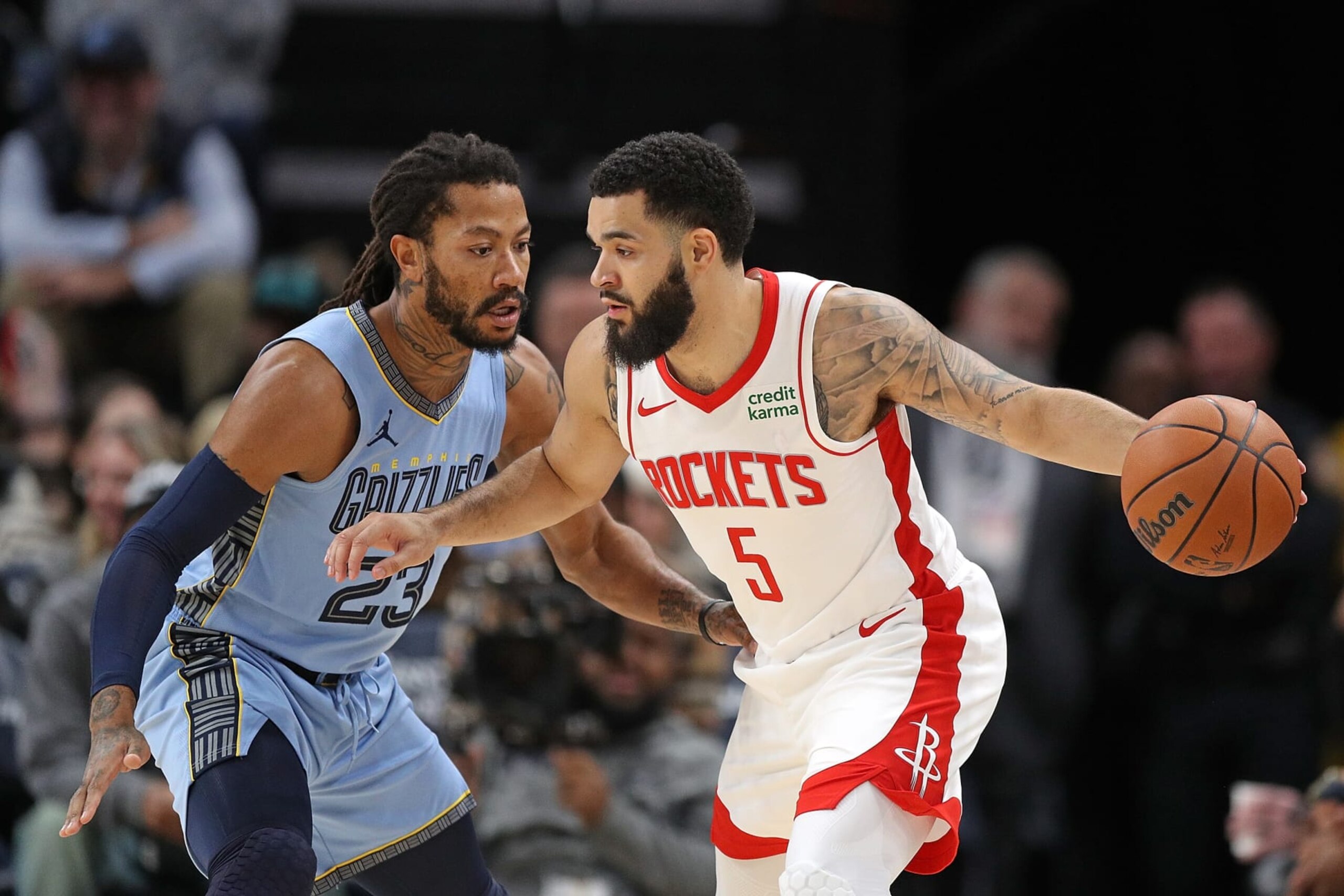 MEMPHIS, TENNESSEE - DECEMBER 15: Fred VanVleet #5 of the Houston Rockets handles the ball against Derrick Rose #23 of the Memphis Grizzlies during the first half at FedExForum on December 15, 2023 in Memphis, Tennessee. NOTE TO USER: User expressly acknowledges and agrees that, by downloading and or using this photograph, User is consenting to the terms and conditions of the Getty Images License Agreement. (Photo by Justin Ford/Getty Images)