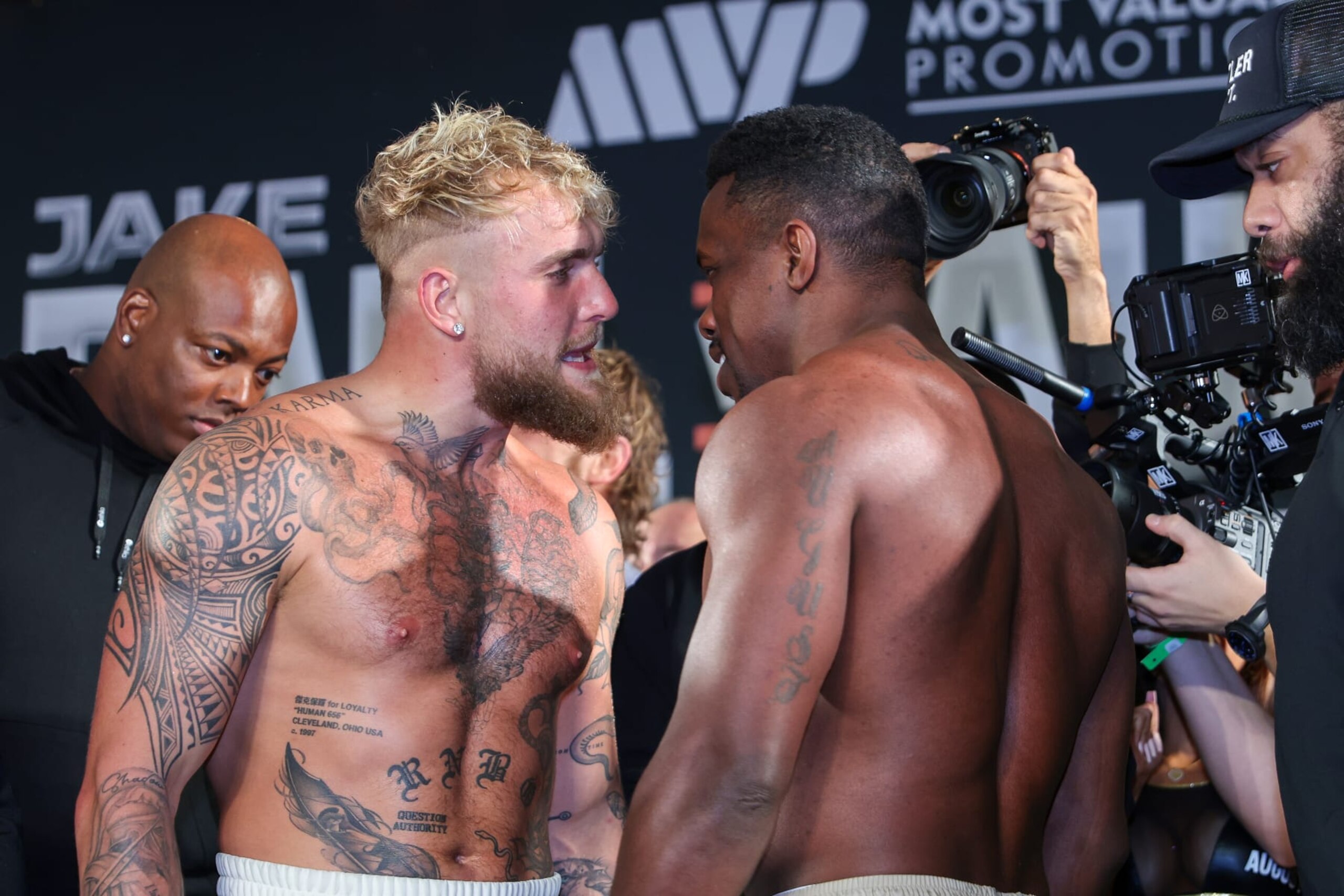 ORLANDO, FL - DECEMBER 14: Jake Paul (L) talks to Andre August during the Jake Paul v Andre August - Weigh-in at the Caribe Royale Orlando on December 14, 2023 in Orlando, Florida. (Photo by Alex Menendez/Getty Images)