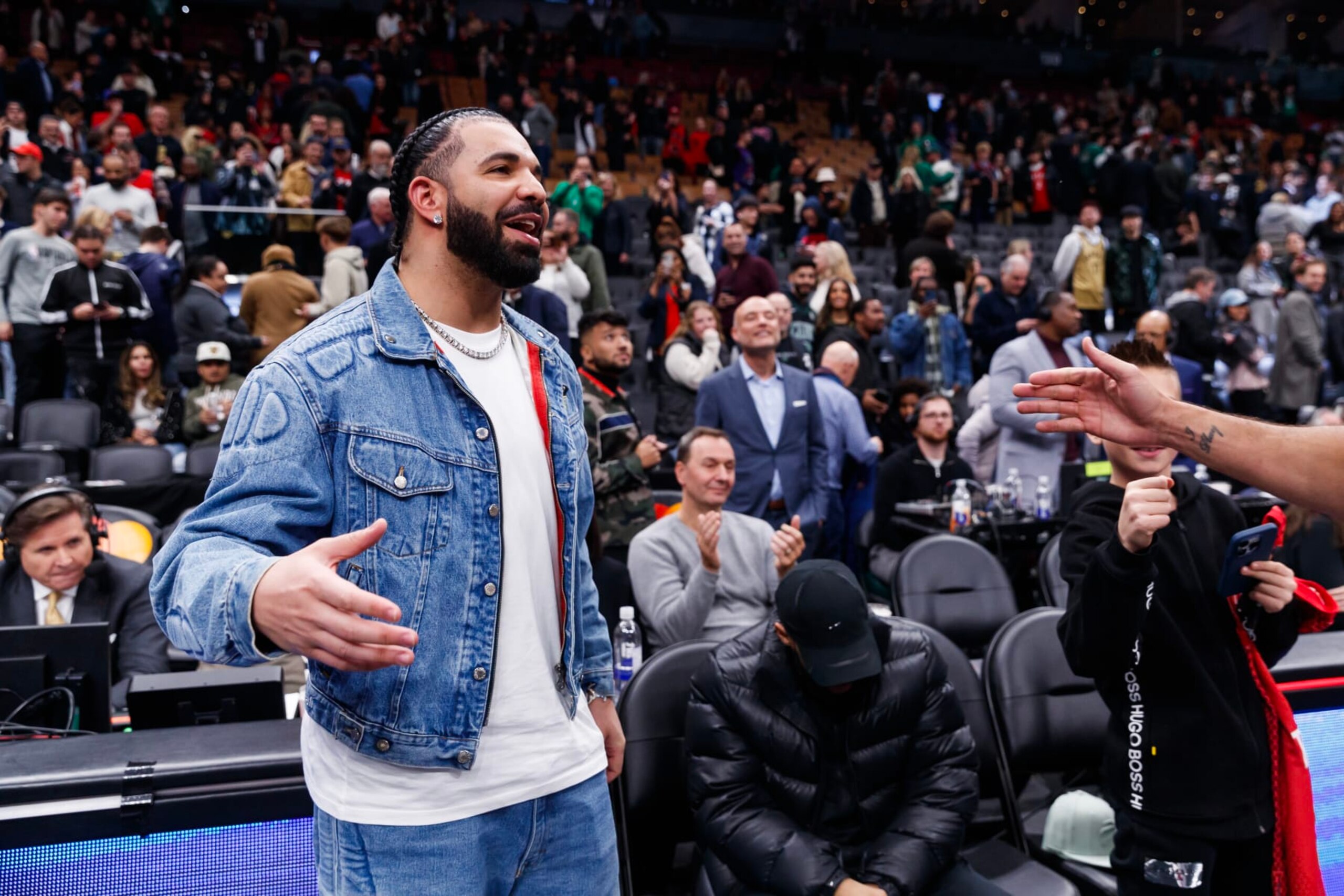 TORONTO, CANADA - NOVEMBER 17: Rapper Drake greets Jayson Tatum #0 of the Boston Celtics after their NBA In-Season Tournament game against the Toronto Raptors at Scotiabank Arena on November 17, 2023 in Toronto, Canada. NOTE TO USER: User expressly acknowledges and agrees that, by downloading and or using this photograph, User is consenting to the terms and conditions of the Getty Images License Agreement. (Photo by Cole Burston/Getty Images)