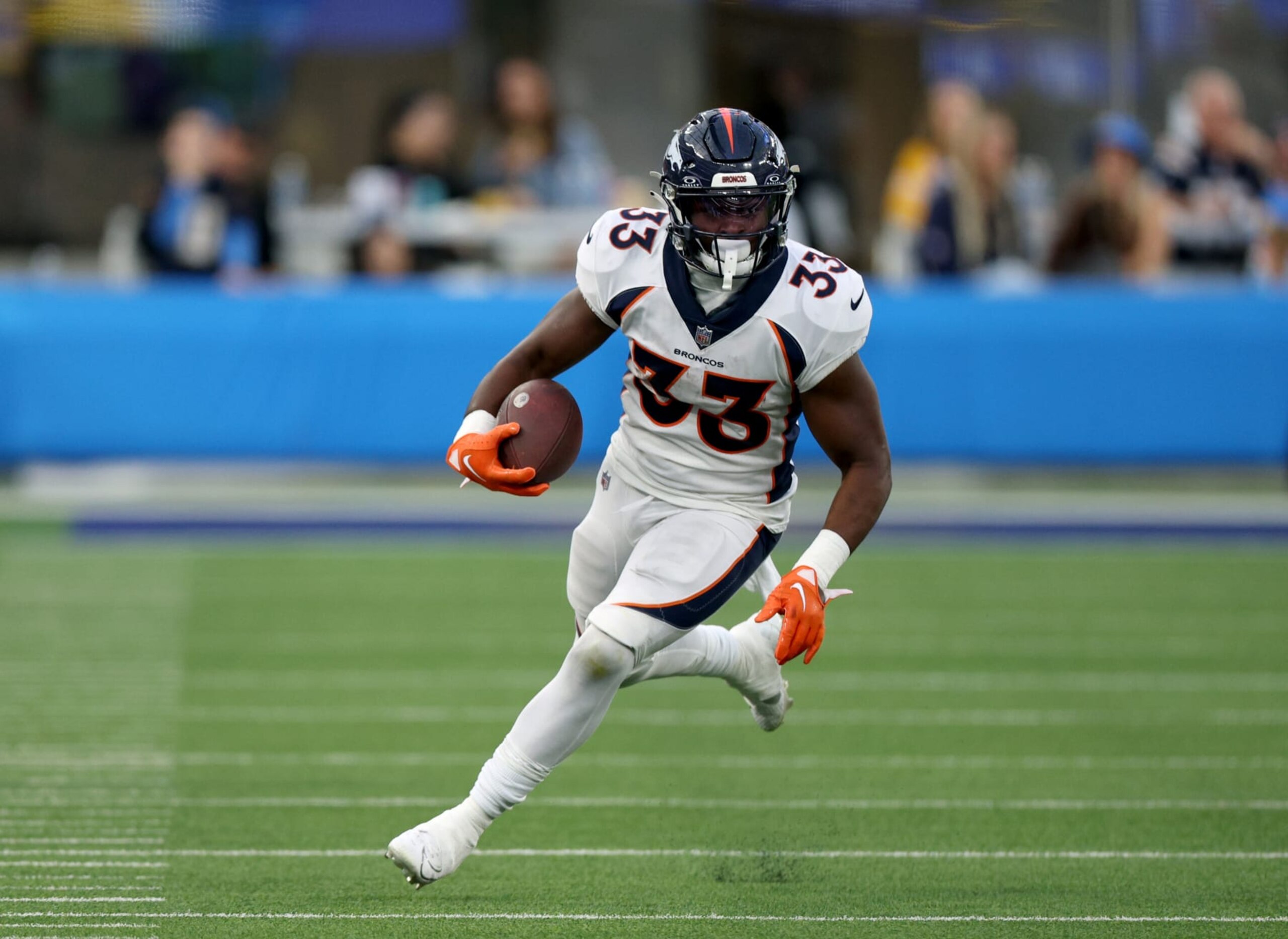 INGLEWOOD, CALIFORNIA - DECEMBER 10: Javonte Williams #33 of the Denver Broncos runs after his catch during a 24-7 win over the Los Angeles Chargers at SoFi Stadium on December 10, 2023 in Inglewood, California. (Photo by Harry How/Getty Images)