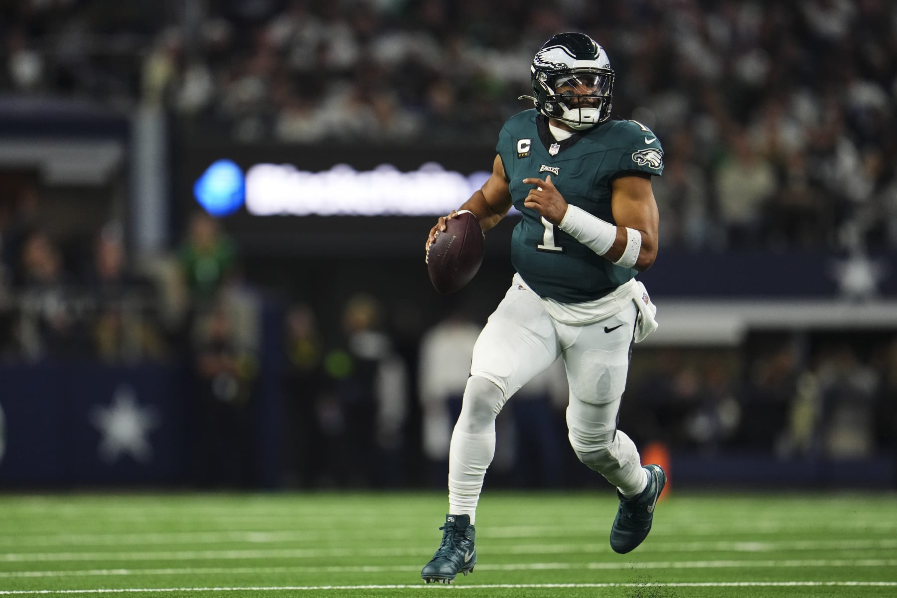 ARLINGTON, TX - DECEMBER 10: Jalen Hurts #1 of the Philadelphia Eagles scrambles out of the pocket during an NFL football game against the Dallas Cowboys at AT&T Stadium on December 10, 2023 in Arlington, Texas. (Photo by Cooper Neill/Getty Images)
