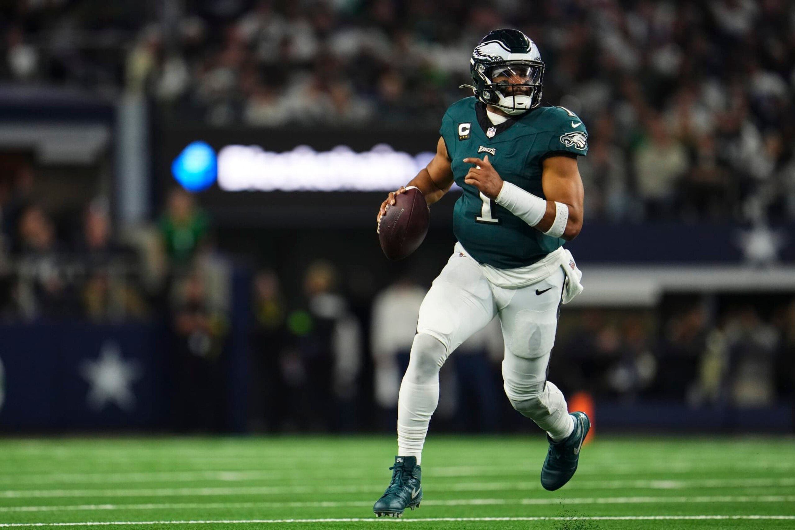 ARLINGTON, TX - DECEMBER 10: Jalen Hurts #1 of the Philadelphia Eagles scrambles out of the pocket during an NFL football game against the Dallas Cowboys at AT&T Stadium on December 10, 2023 in Arlington, Texas. (Photo by Cooper Neill/Getty Images)