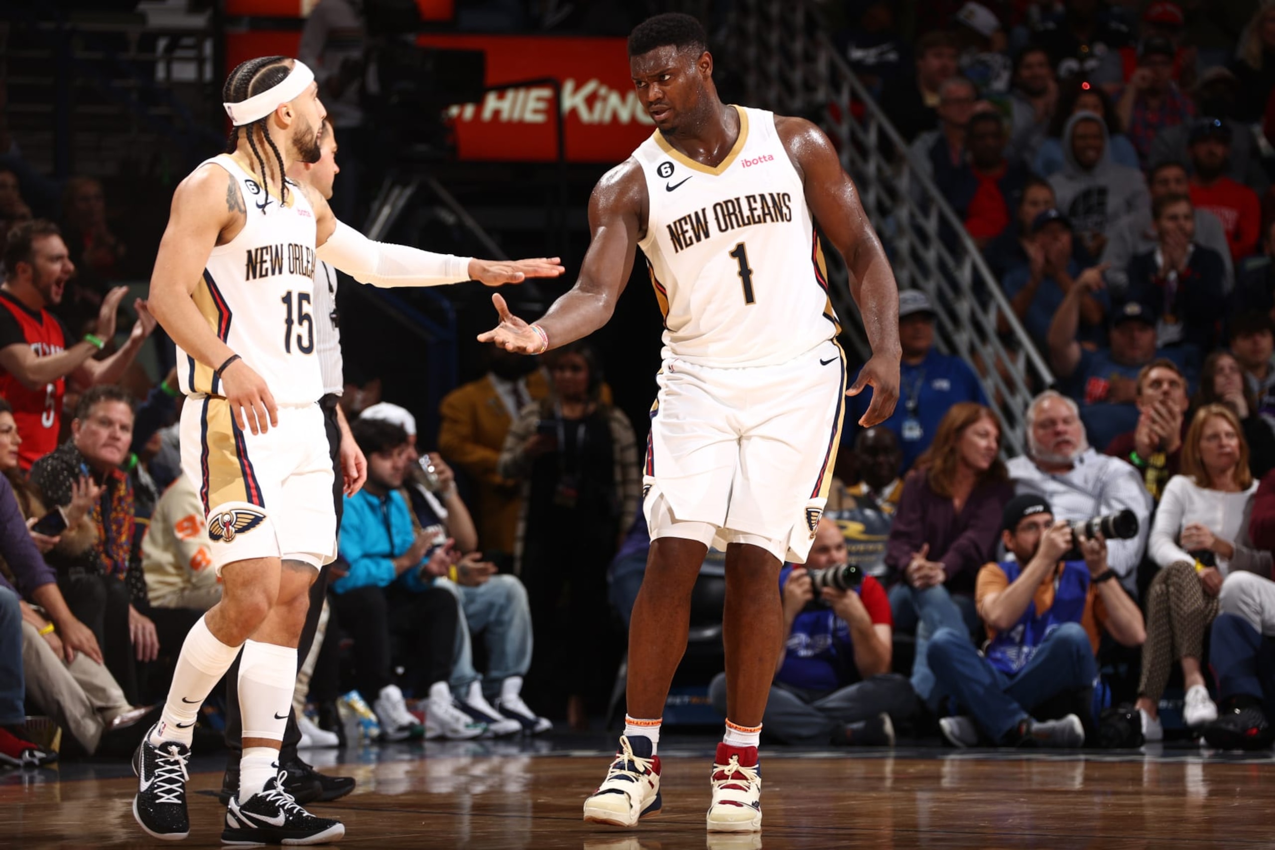 NEW ORLEANS, LA - NOVEMBER 28:  Zion Williamson #1 and Jose Alvarado #15 of the New Orleans Pelicans high five during the game against the Oklahoma City Thunder on November 28, 2022 at the Smoothie King Center in New Orleans, Louisiana. NOTE TO USER: User expressly acknowledges and agrees that, by downloading and or using this Photograph, user is consenting to the terms and conditions of the Getty Images License Agreement. Mandatory Copyright Notice: Copyright 2022 NBAE (Photo by Ned Dishman/NBAE via Getty Images)