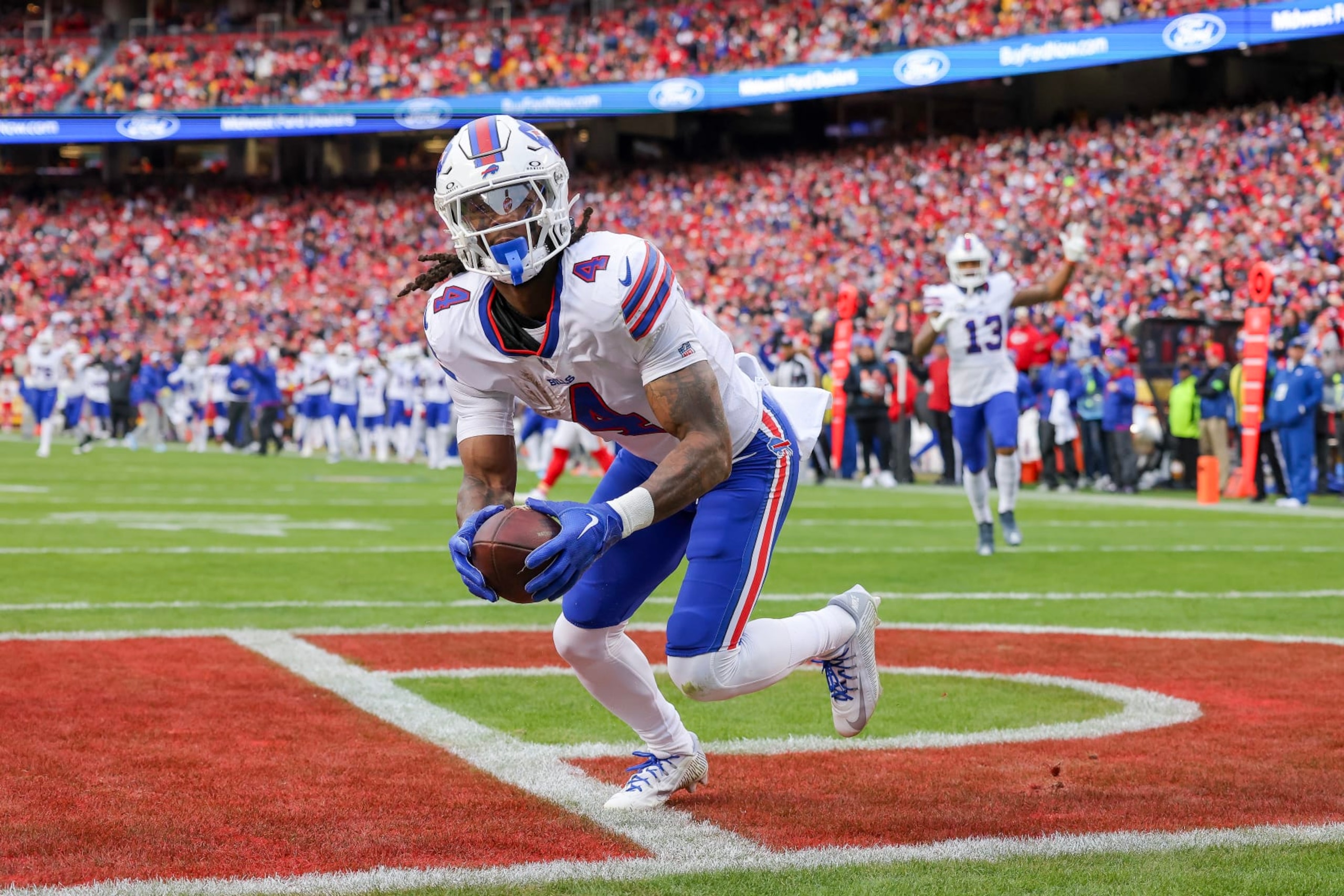 KANSAS CITY, MISSOURI - DECEMBER 10: James Cook #4 of the Buffalo Bills reacts after scoring a touchdown during the first half of the game against the Kansas City Chiefs at GEHA Field at Arrowhead Stadium on December 10, 2023 in Kansas City, Missouri. (Photo by Jamie Squire/Getty Images) KANSAS CITY, MISSOURI - DECEMBER 10: James Cook #4 of the Buffalo Bills reacts after scoring a touchdown during the first half of the game against the Kansas City Chiefs at GEHA Field at Arrowhead Stadium on December 10, 2023 in Kansas City, Missouri. (Photo by Jamie Squire/Getty Images)