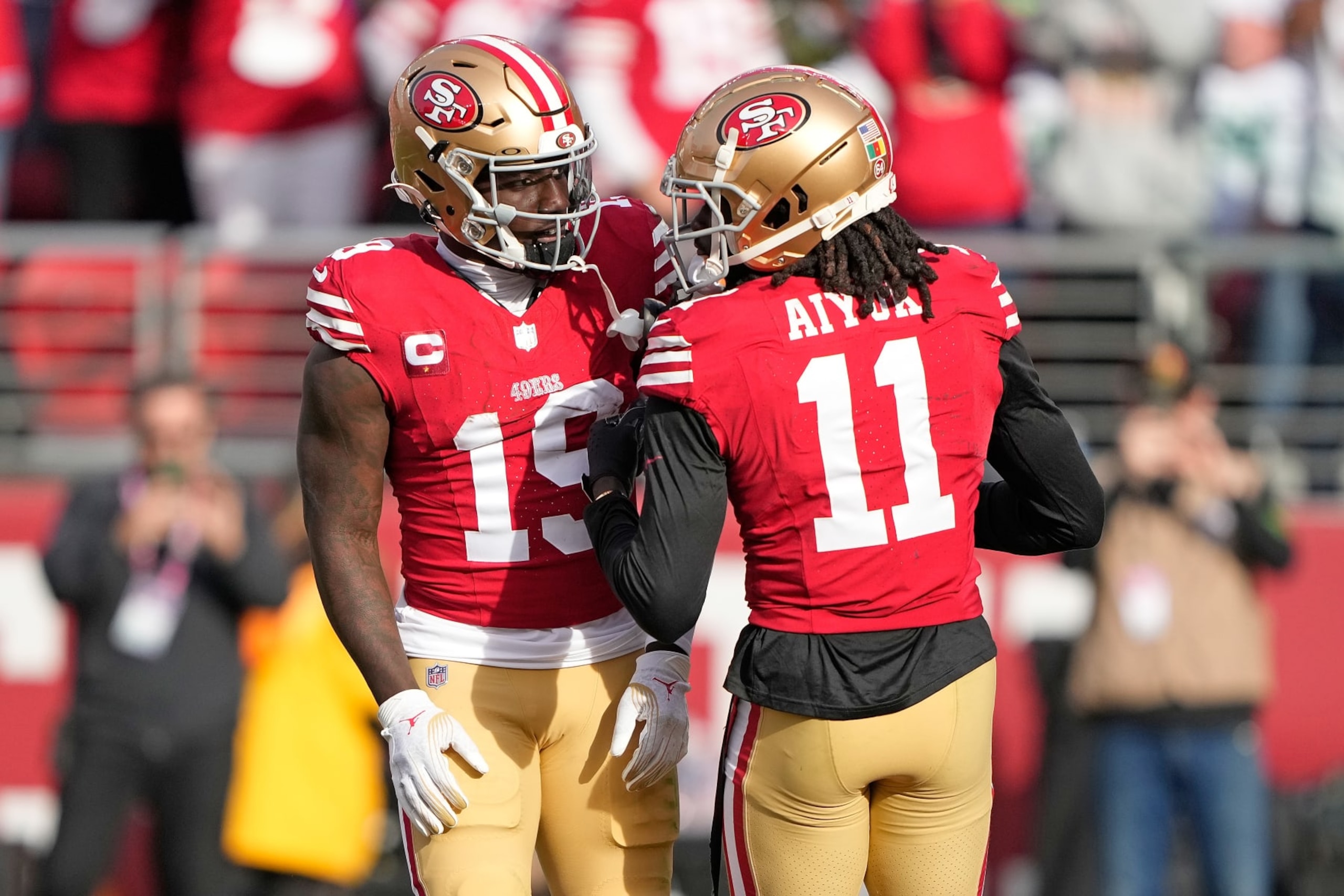 SANTA CLARA, CALIFORNIA - DECEMBER 10: Deebo Samuel #19 of the San Francisco 49ers celebrates a touchdown with Brandon Aiyuk #11 during the second quarter in the game against the Seattle Seahawks at Levi's Stadium on December 10, 2023 in Santa Clara, California. (Photo by Thearon W. Henderson/Getty Images) SANTA CLARA, CALIFORNIA - DECEMBER 10: Deebo Samuel #19 of the San Francisco 49ers celebrates a touchdown with Brandon Aiyuk #11 during the second quarter in the game against the Seattle Seahawks at Levi's Stadium on December 10, 2023 in Santa Clara, California. (Photo by Thearon W. Henderson/Getty Images)