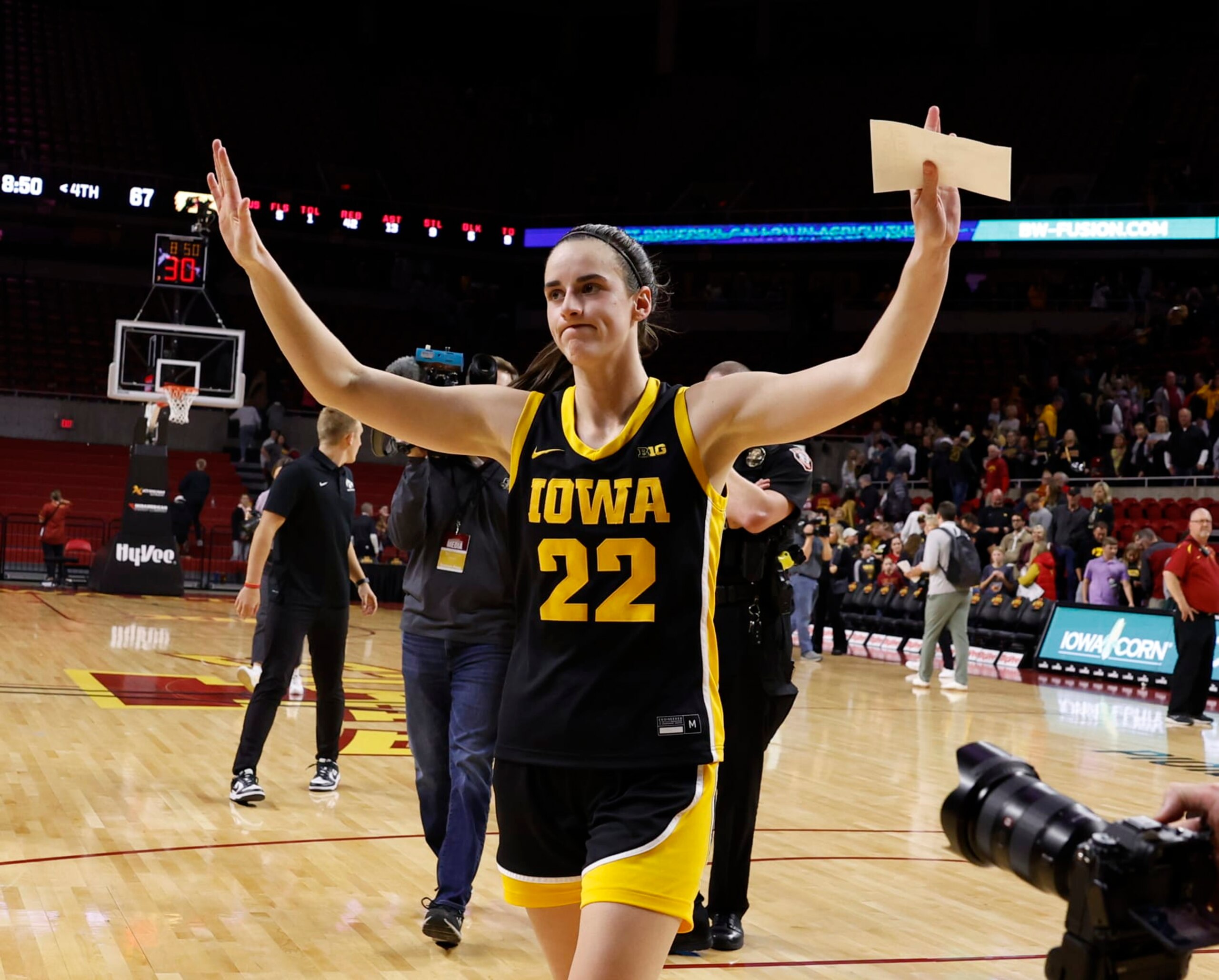 AMES, IA - DECEMBER 6: Caitlin Clark #22 of the Iowa Hawkeyes reacts after the Iowa Hawkeyes won 67-58 over the Iowa State Cyclones. Clark became the 15th player in Division I women's basketball history to reach 3,000 points for her career when she broke 3,000 points with a three point basket in the game at Hilton Coliseum on December 6, 2023 in Ames, Iowa. They Iowa Hawkeyes won 67-58 over the Iowa State Cyclones. (Photo by David K Purdy/Getty Images)